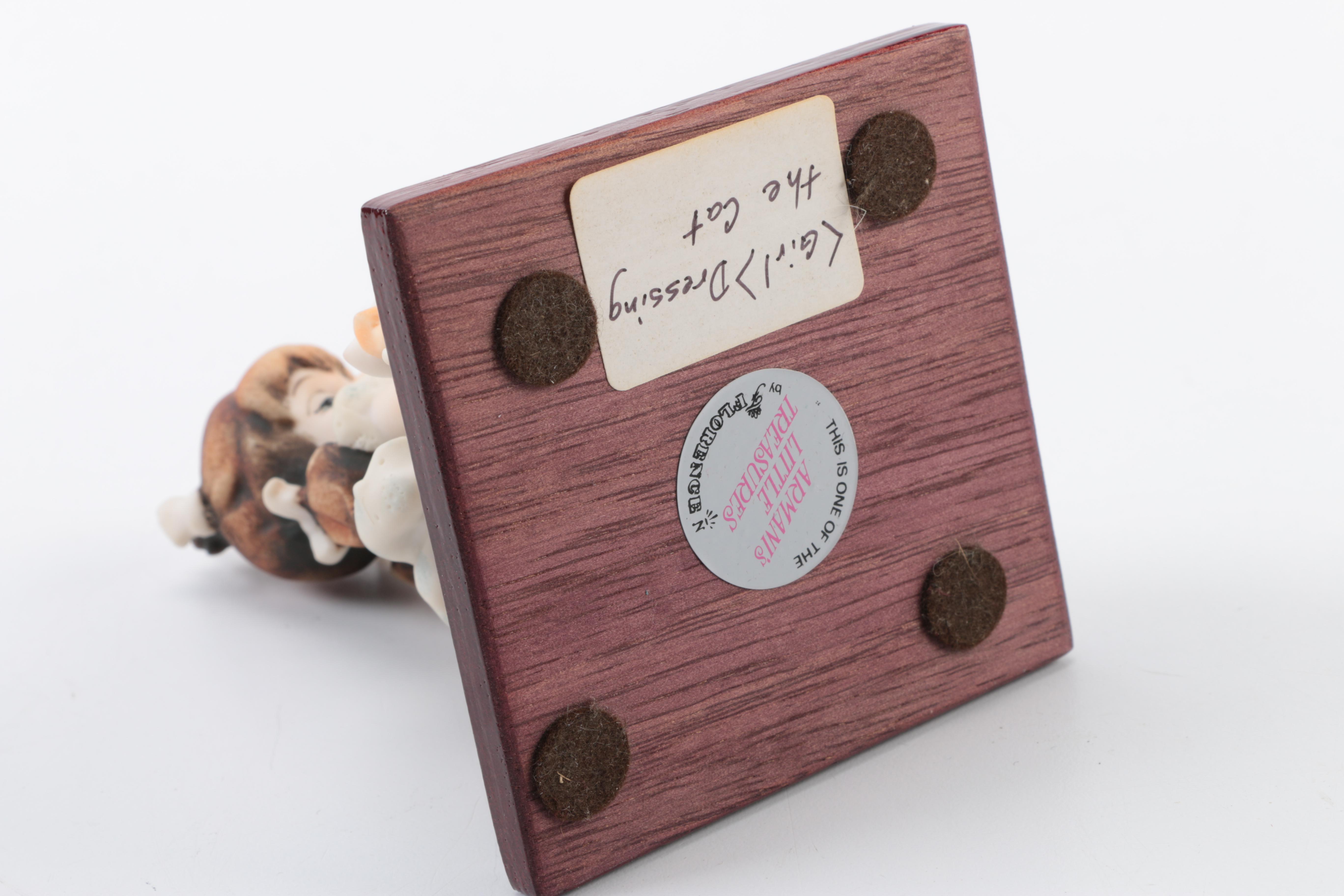 Vintage Ceramic Figurines featuring G. Armani and Norman Rockwell