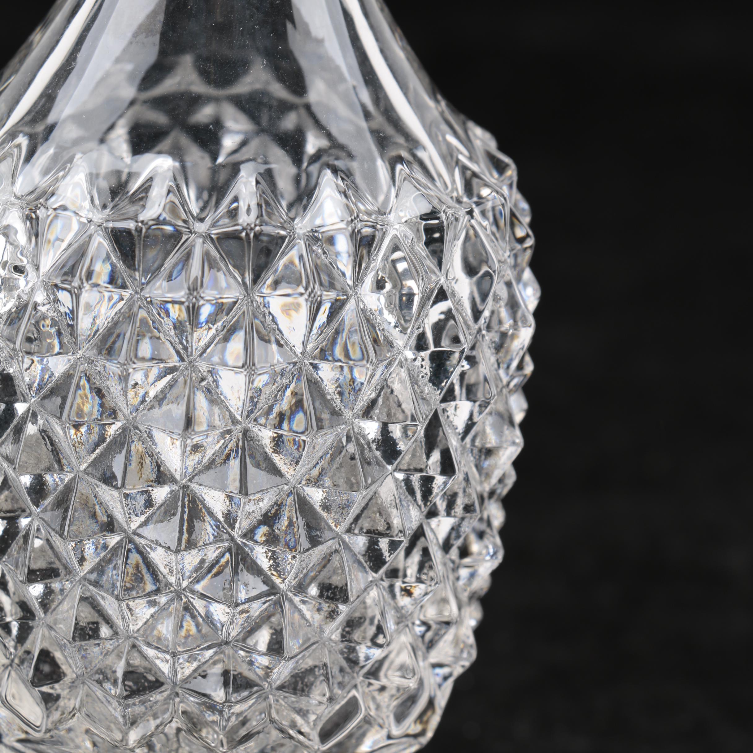 Group of Cut and Molded Glass Decanters with Decorative Stoppers