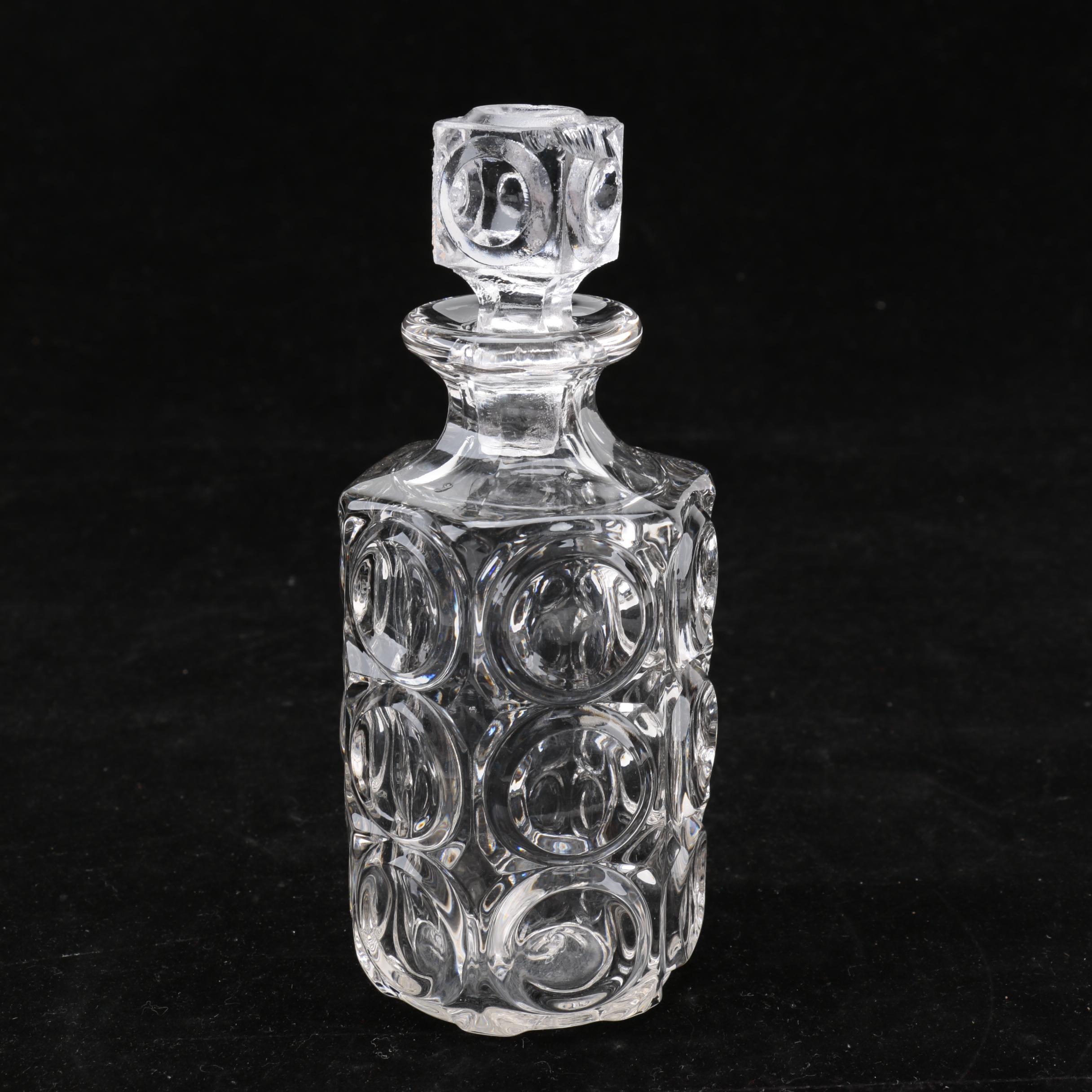 Group of Cut and Molded Glass Decanters with Decorative Stoppers