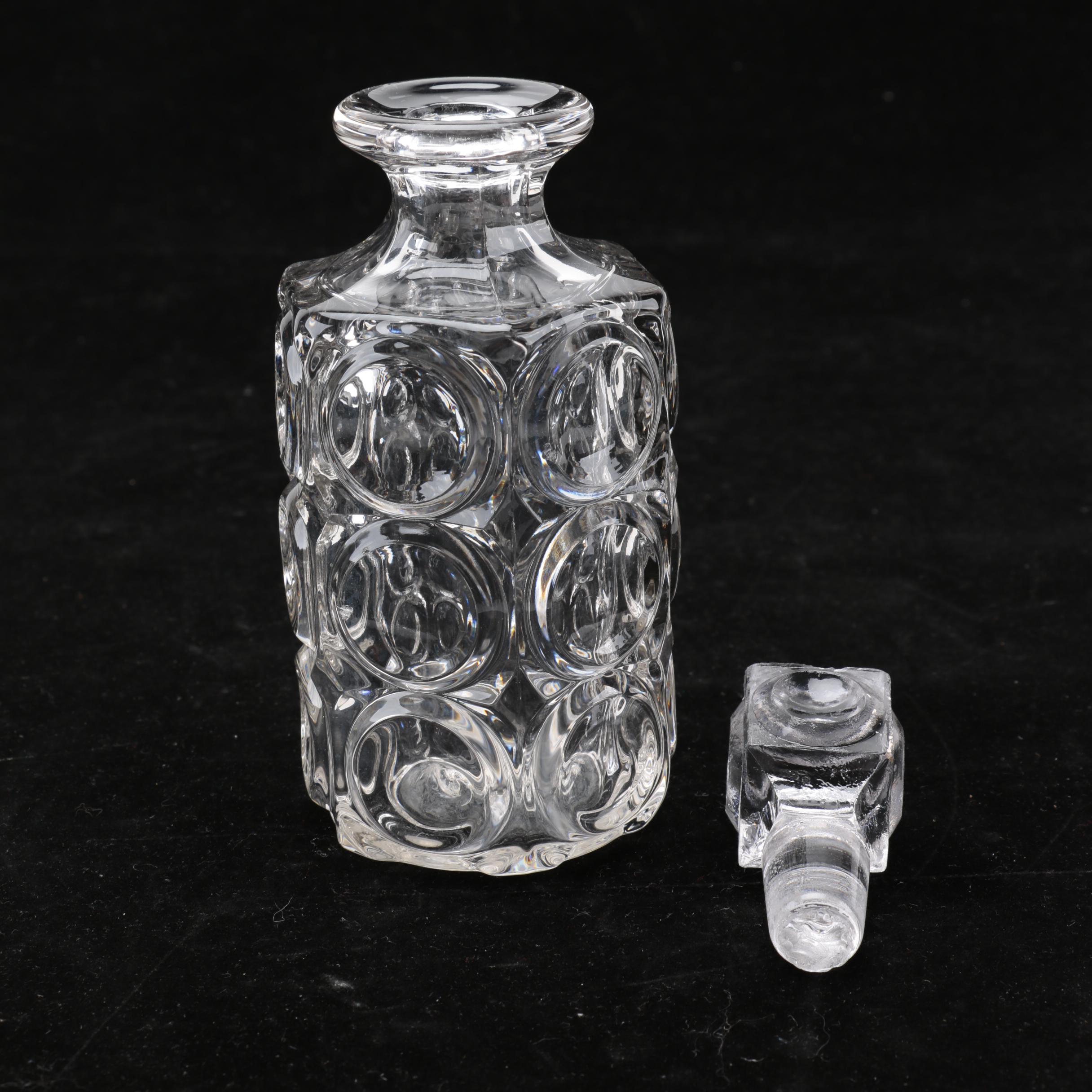Group of Cut and Molded Glass Decanters with Decorative Stoppers