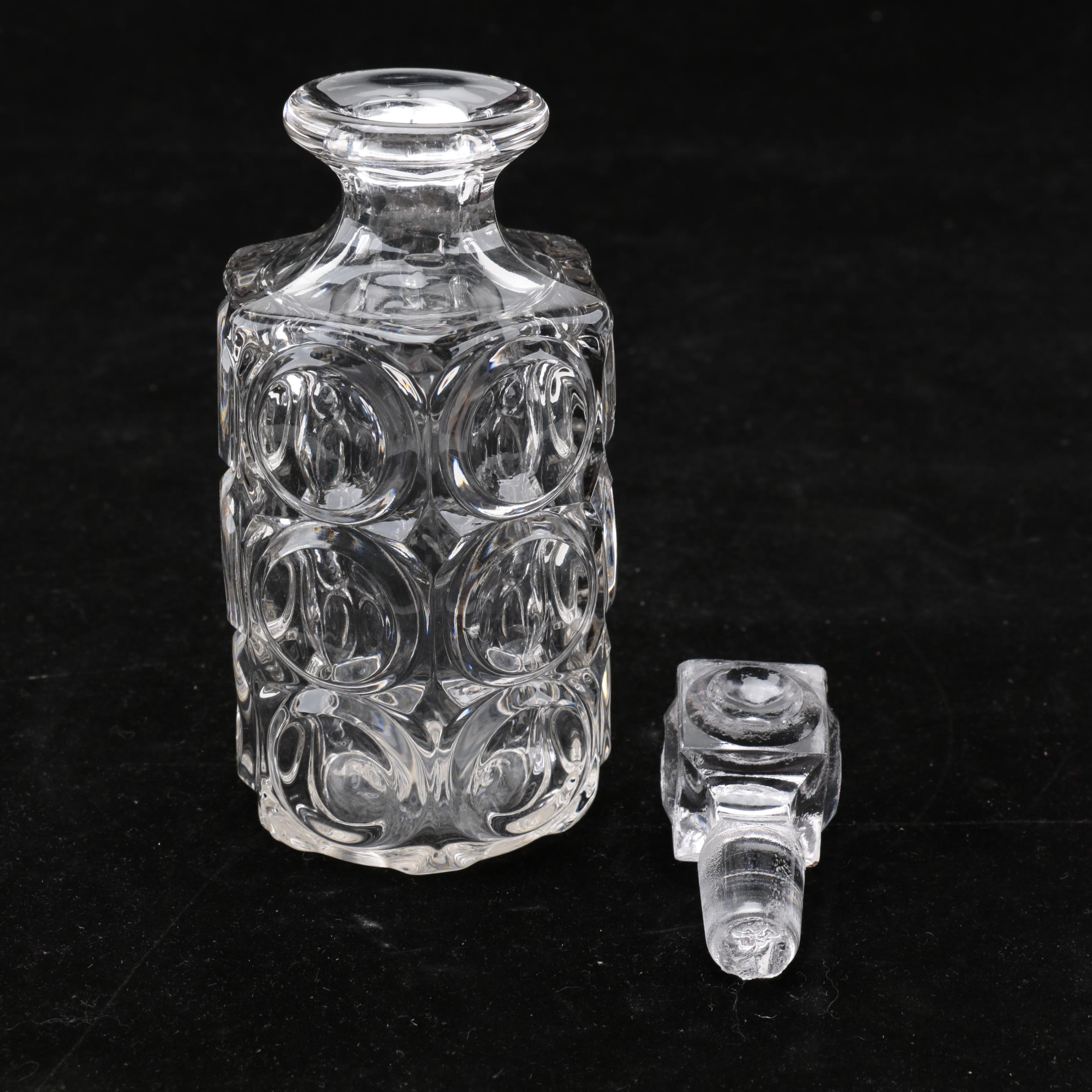 Group of Cut and Molded Glass Decanters with Decorative Stoppers