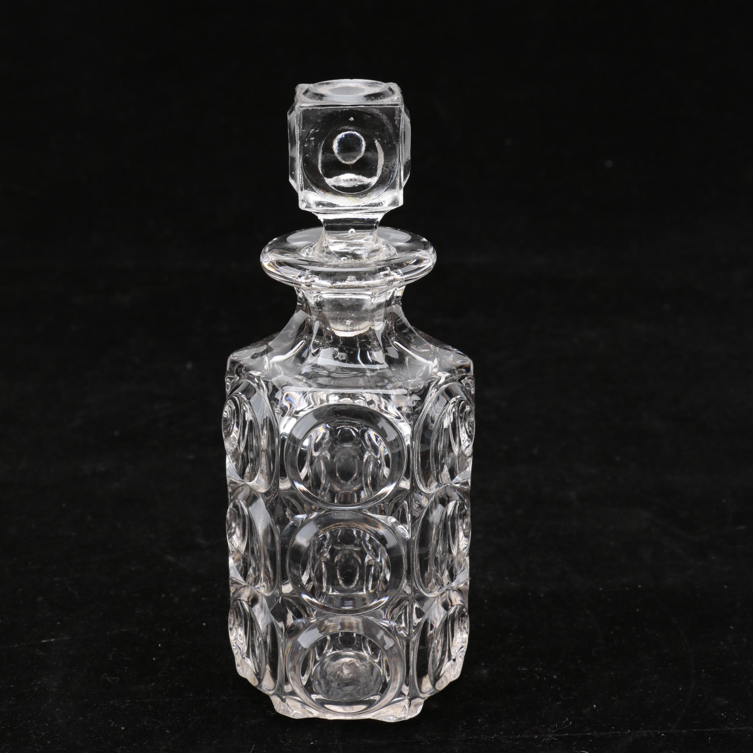 Group of Cut and Molded Glass Decanters with Decorative Stoppers