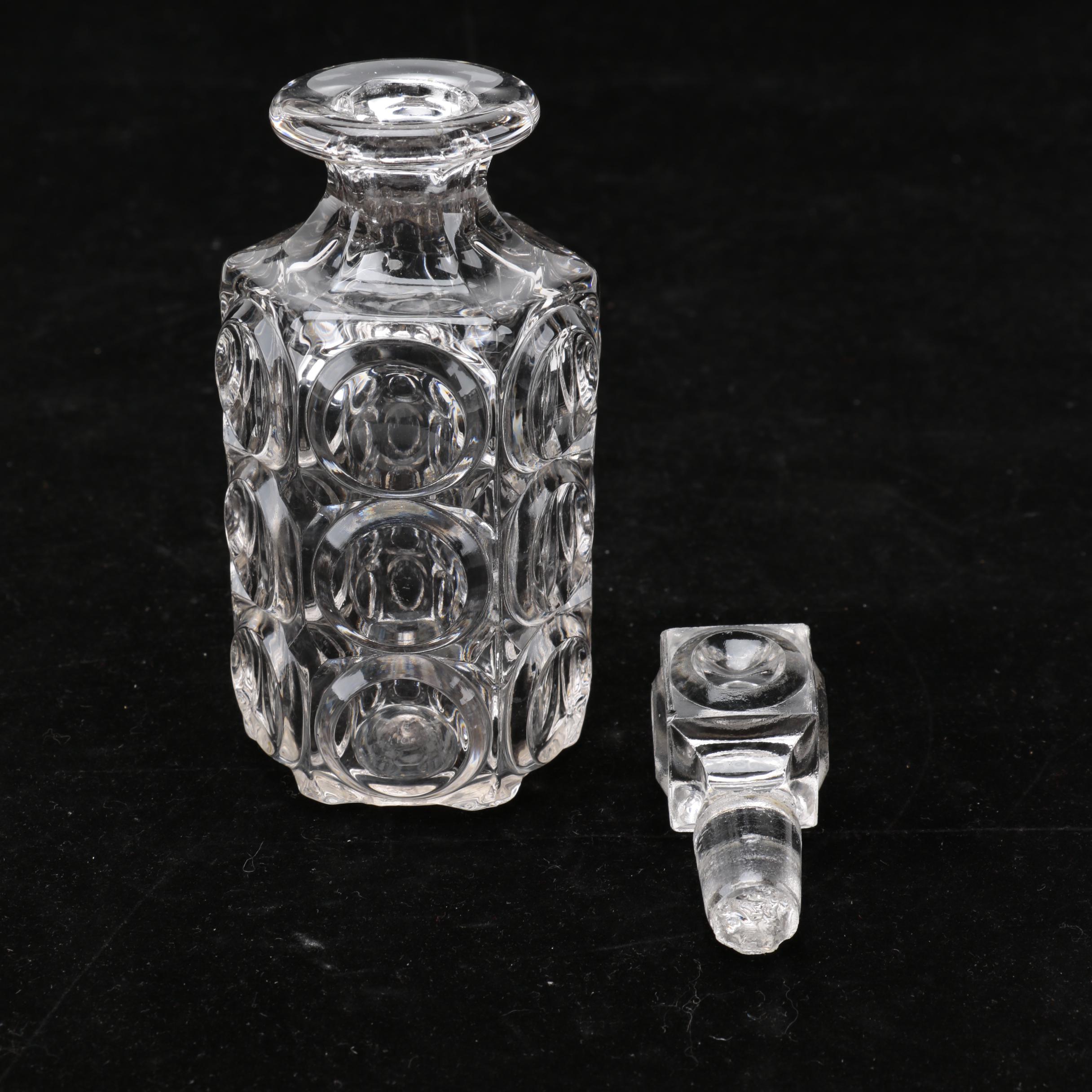 Group of Cut and Molded Glass Decanters with Decorative Stoppers