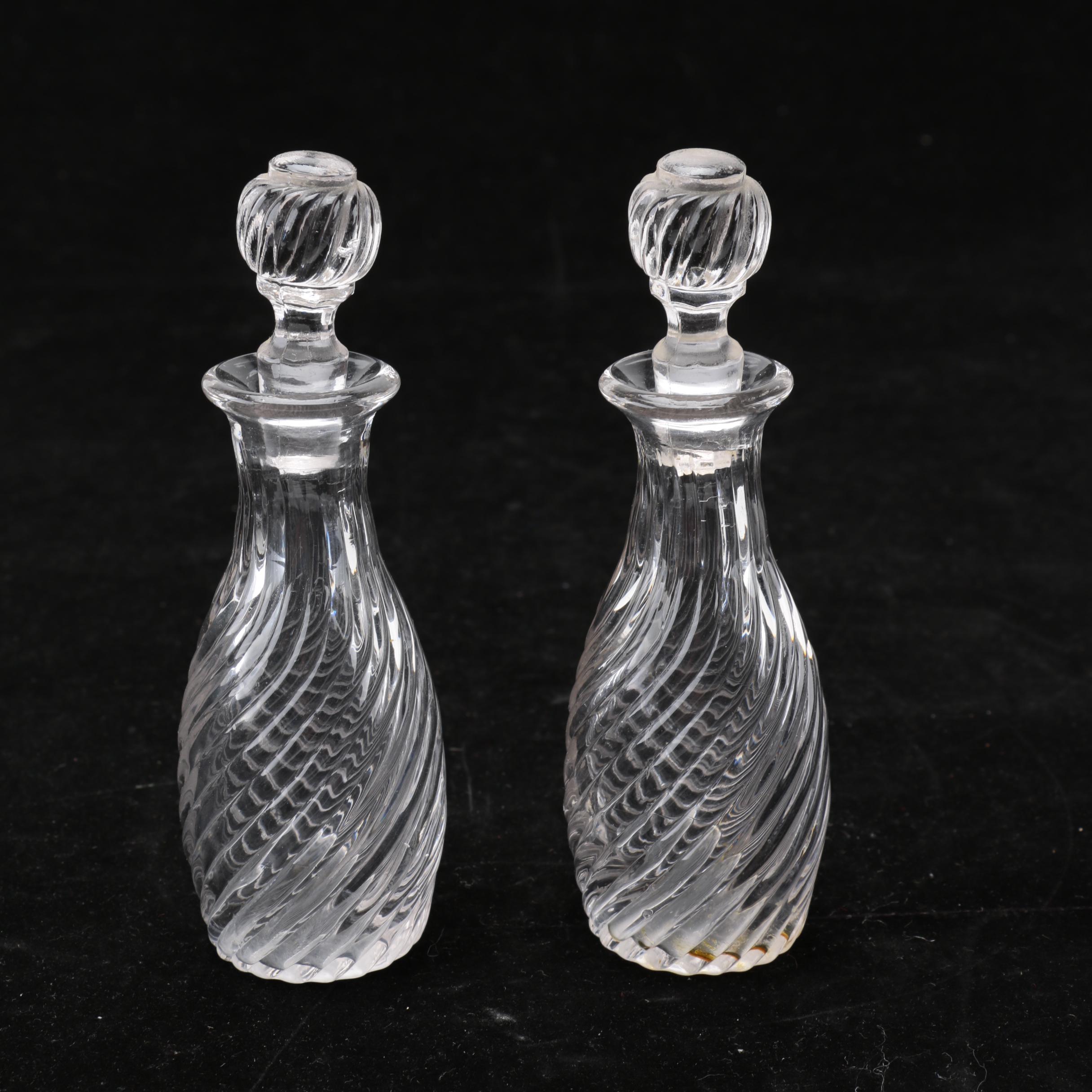 Group of Cut and Molded Glass Decanters with Decorative Stoppers