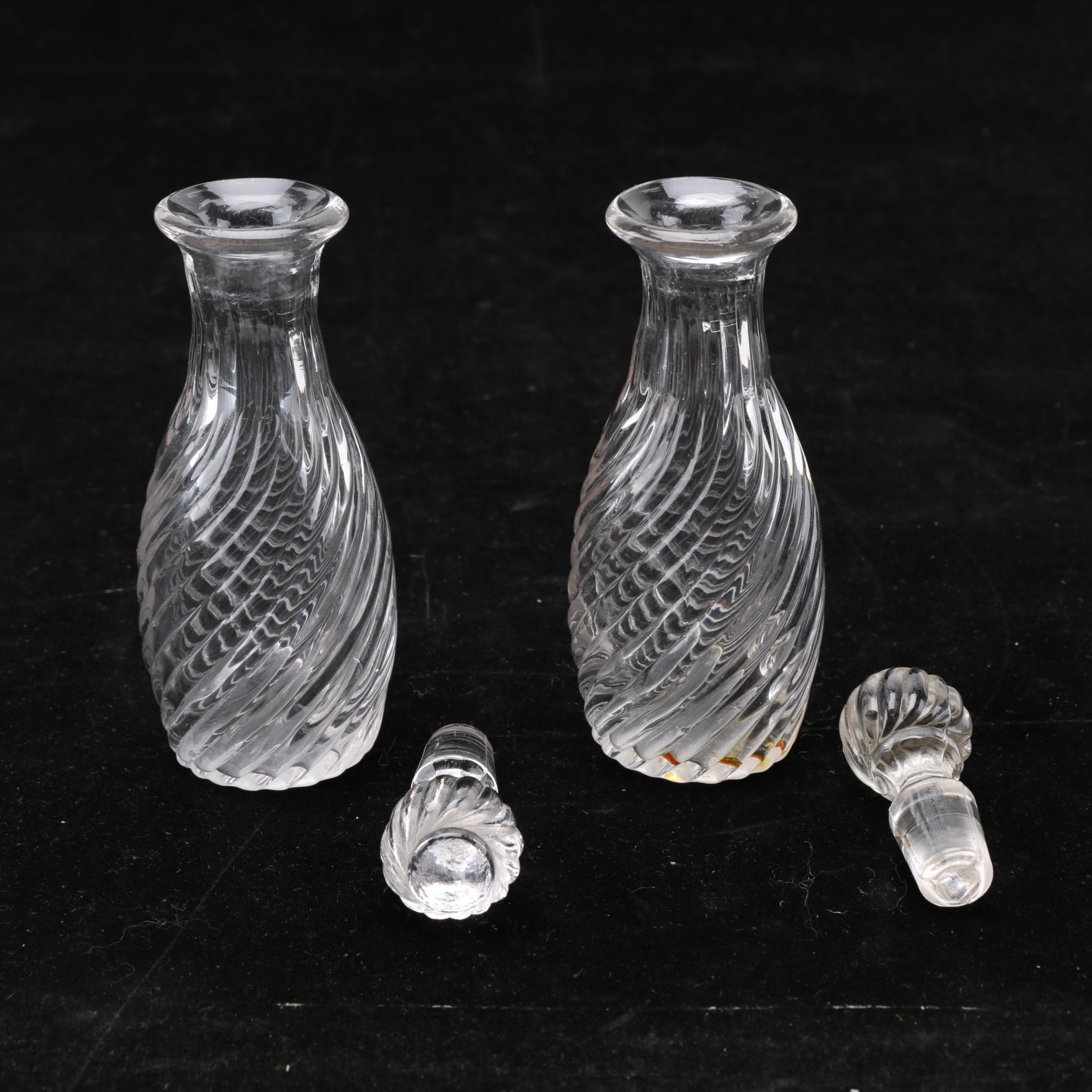 Group of Cut and Molded Glass Decanters with Decorative Stoppers