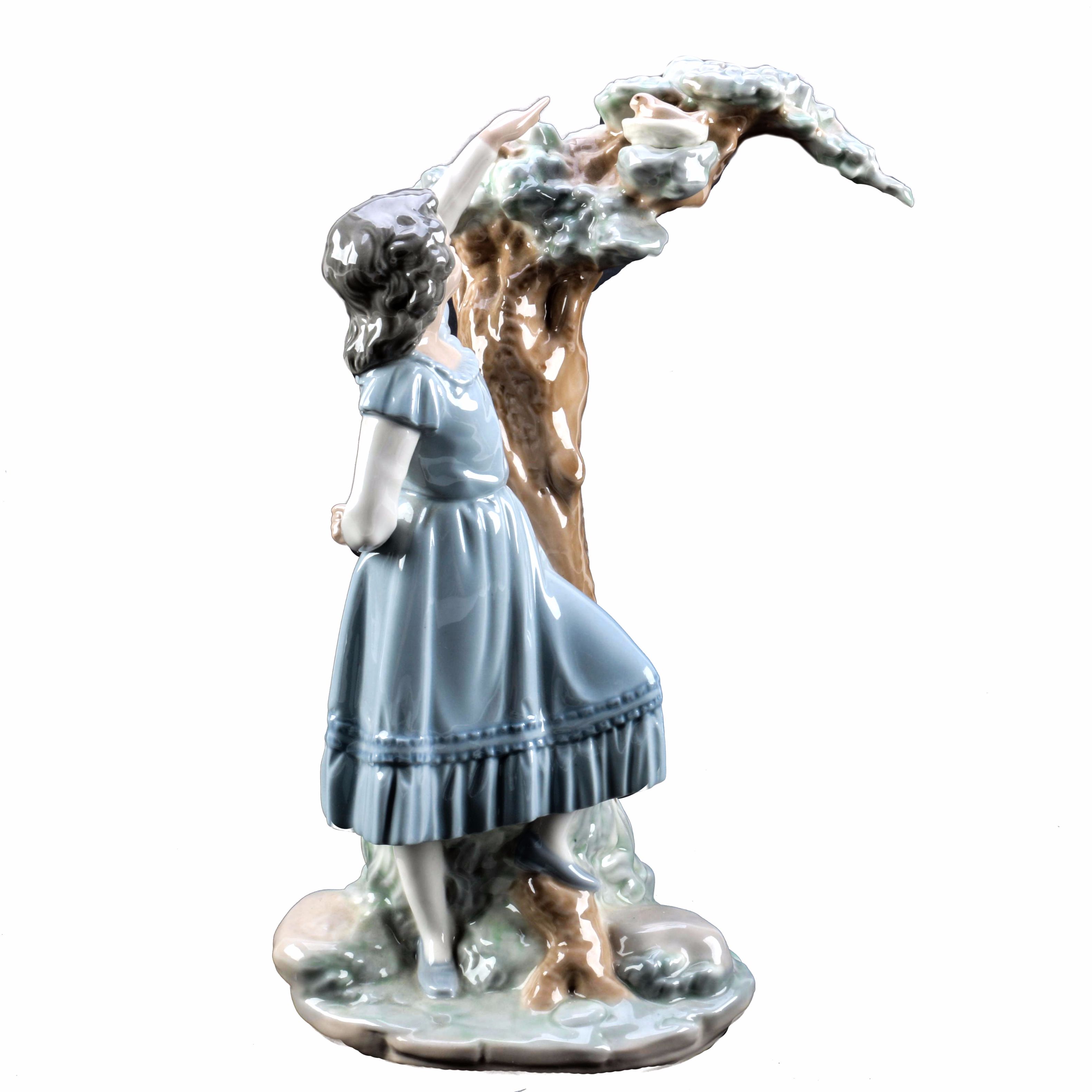 NAO by Lladró "Girl Pointing at Bird Nest" Porcelain Figurine