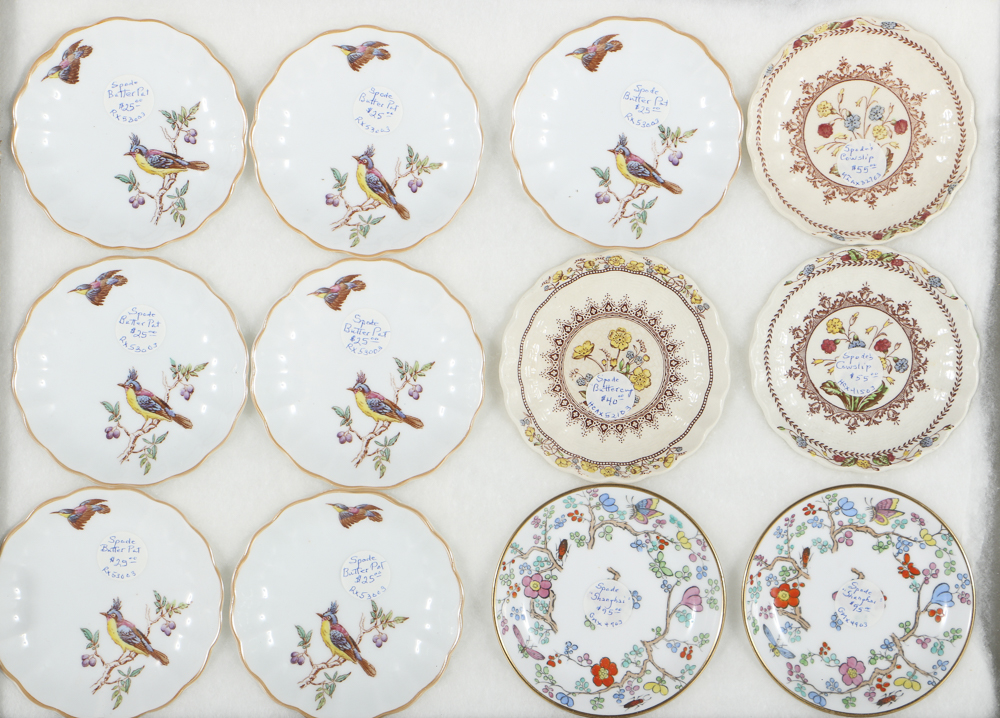 Twelve Porcelain Butter Pats In Glass Top Display Case