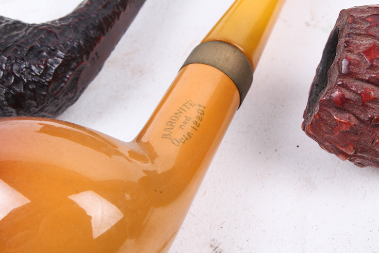 Collection of Smoking Pipes in Wooden Stand