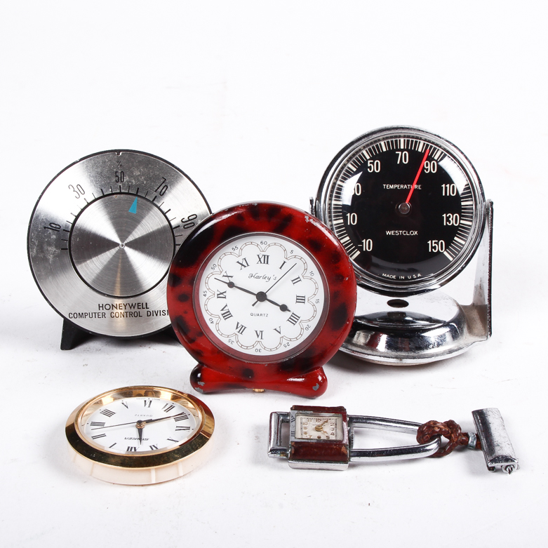 Collection of Clocks and Temperature Gauges