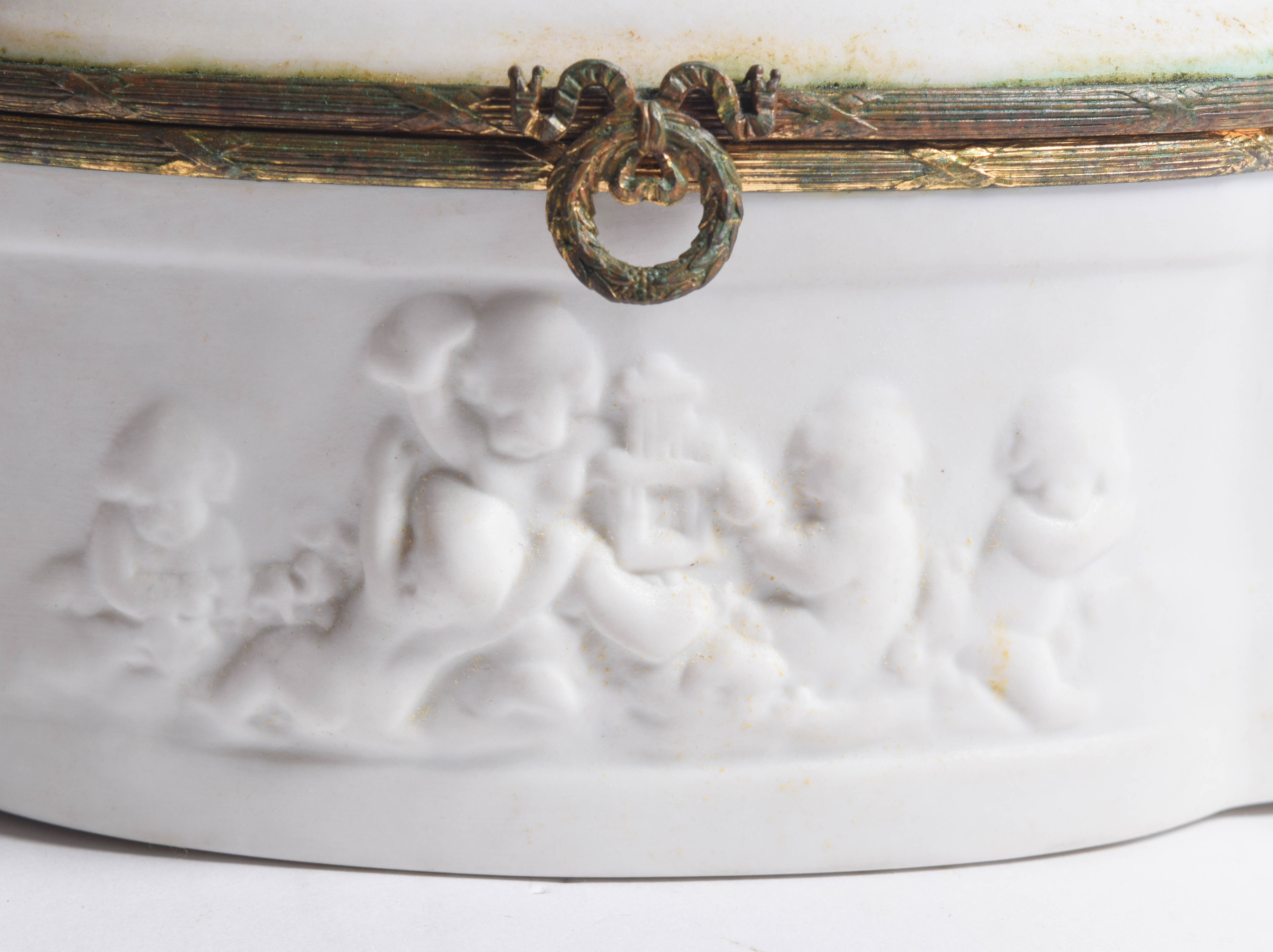 Limoges Porcelain Trinket Box with Raised Cherub Motif