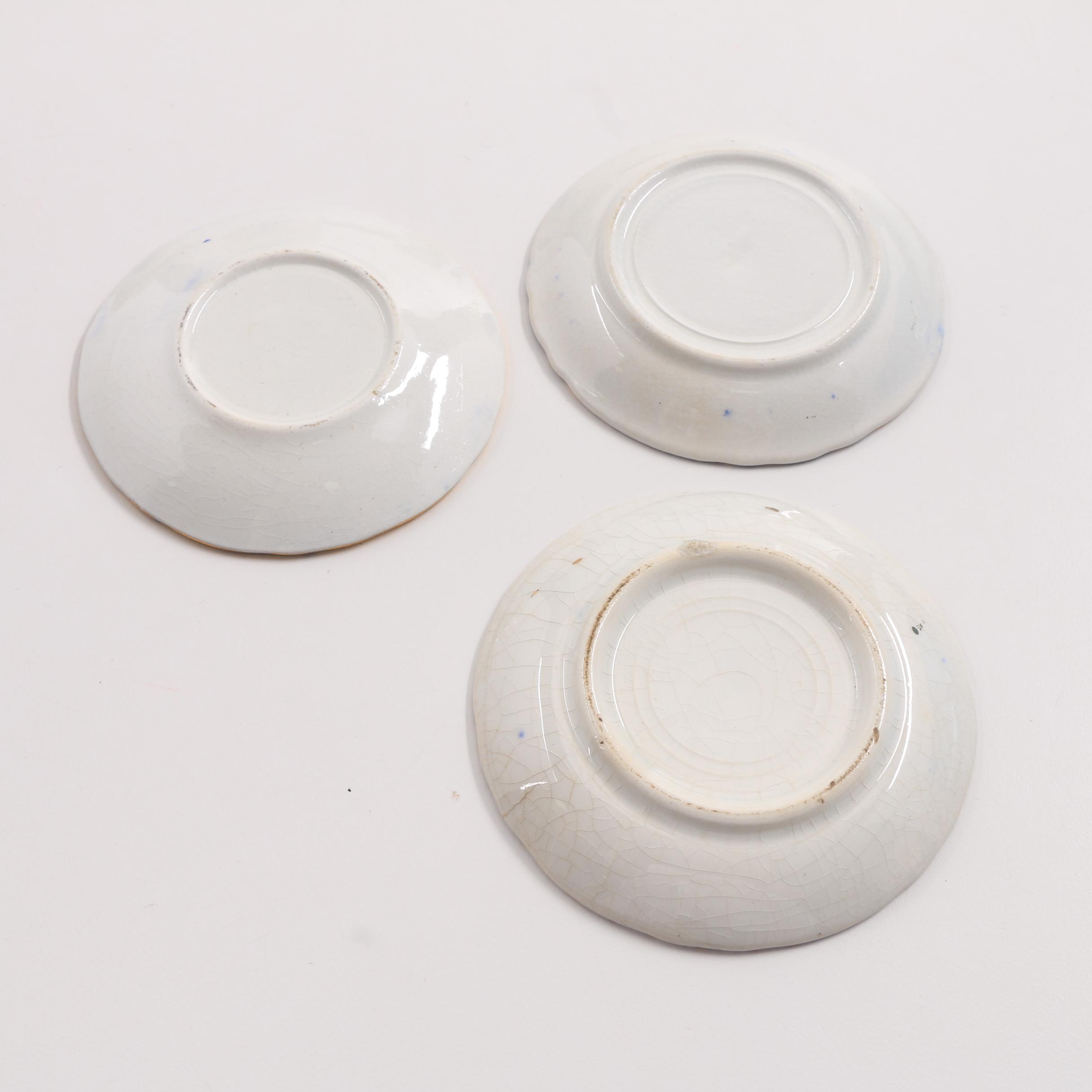 A Collection Of Over 40 Blue and White Butter Pats