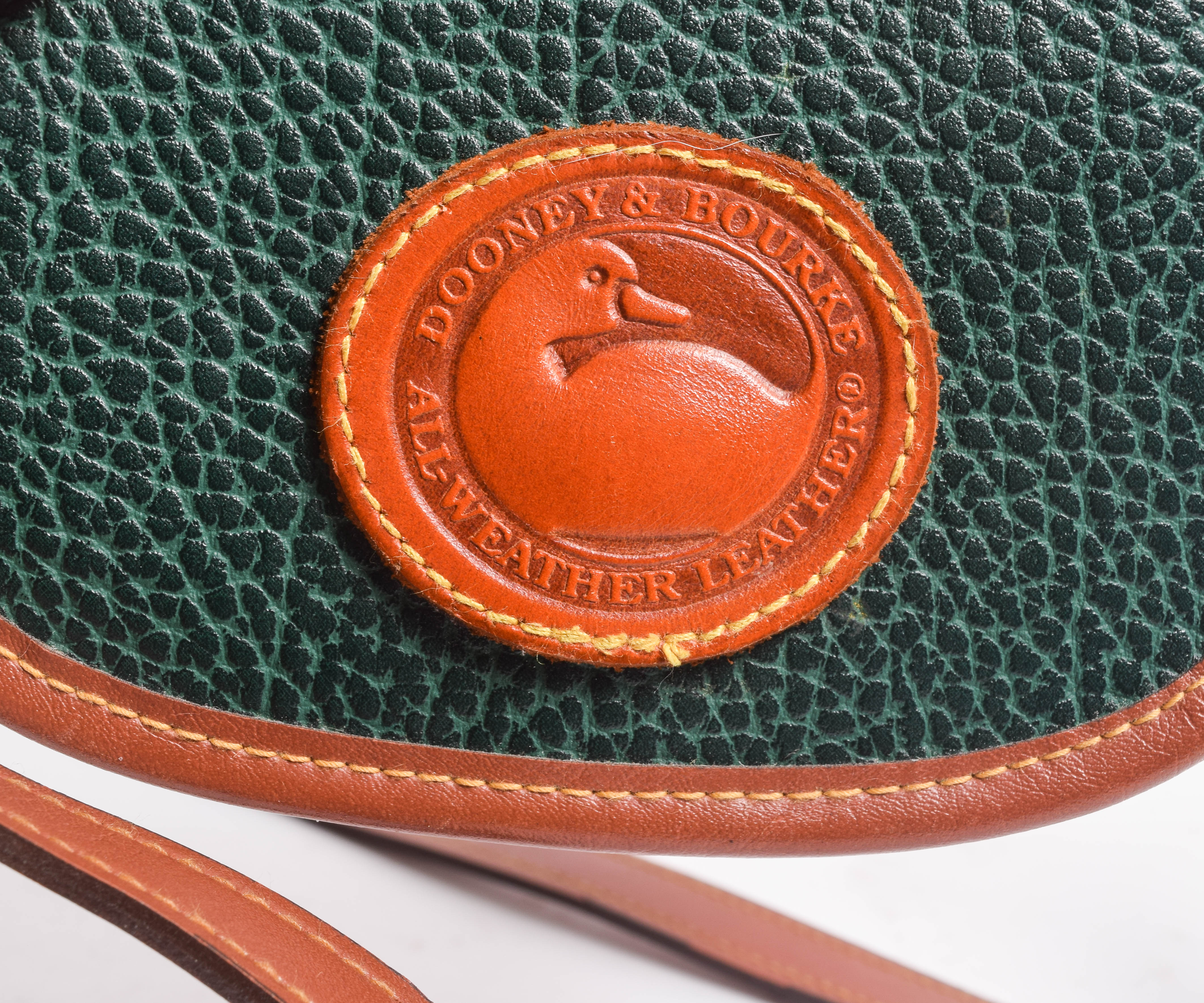 Assortment of Dooney & Bourke Handbags and Cole Haan Wallet