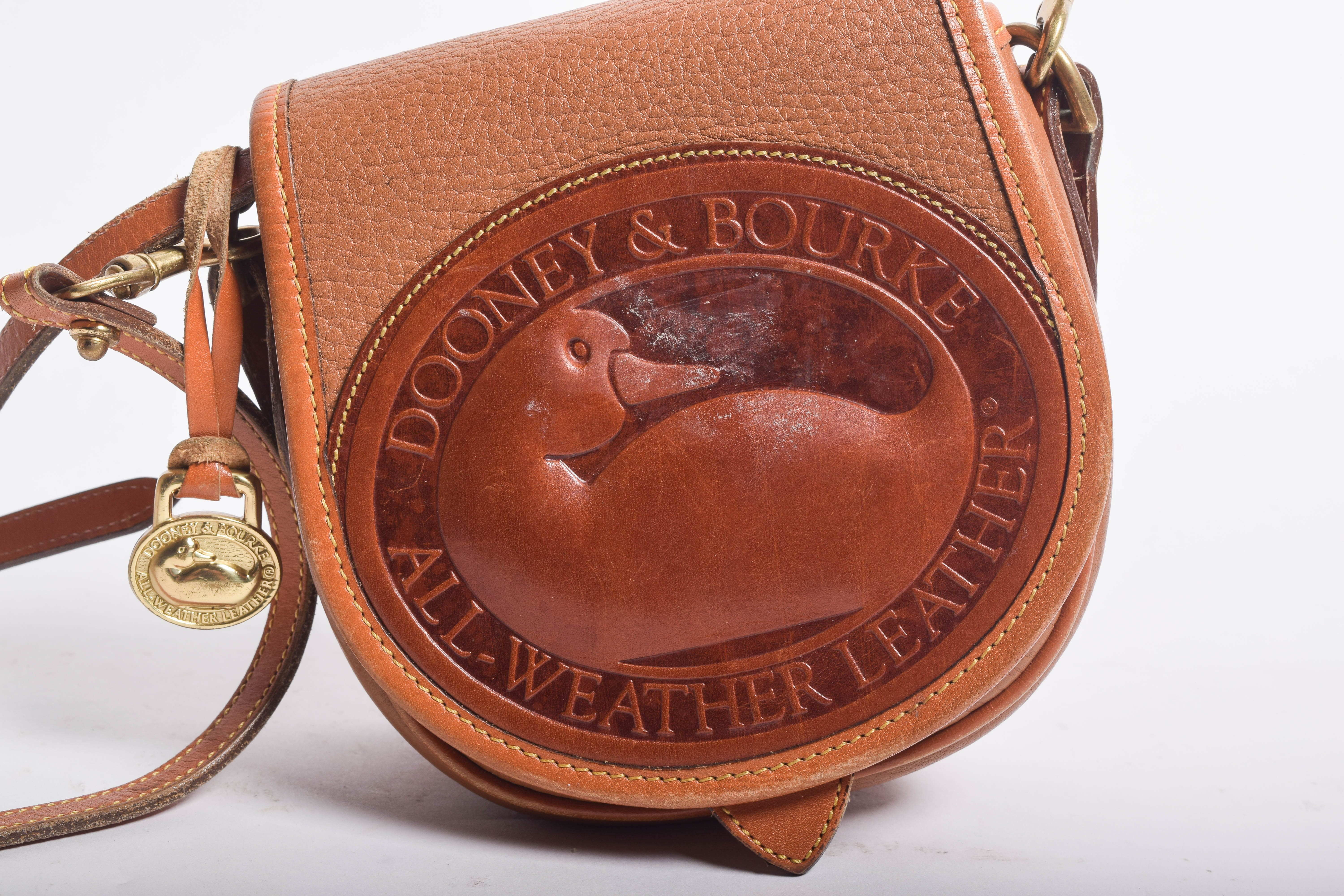 Assortment of Dooney & Bourke Handbags and Cole Haan Wallet