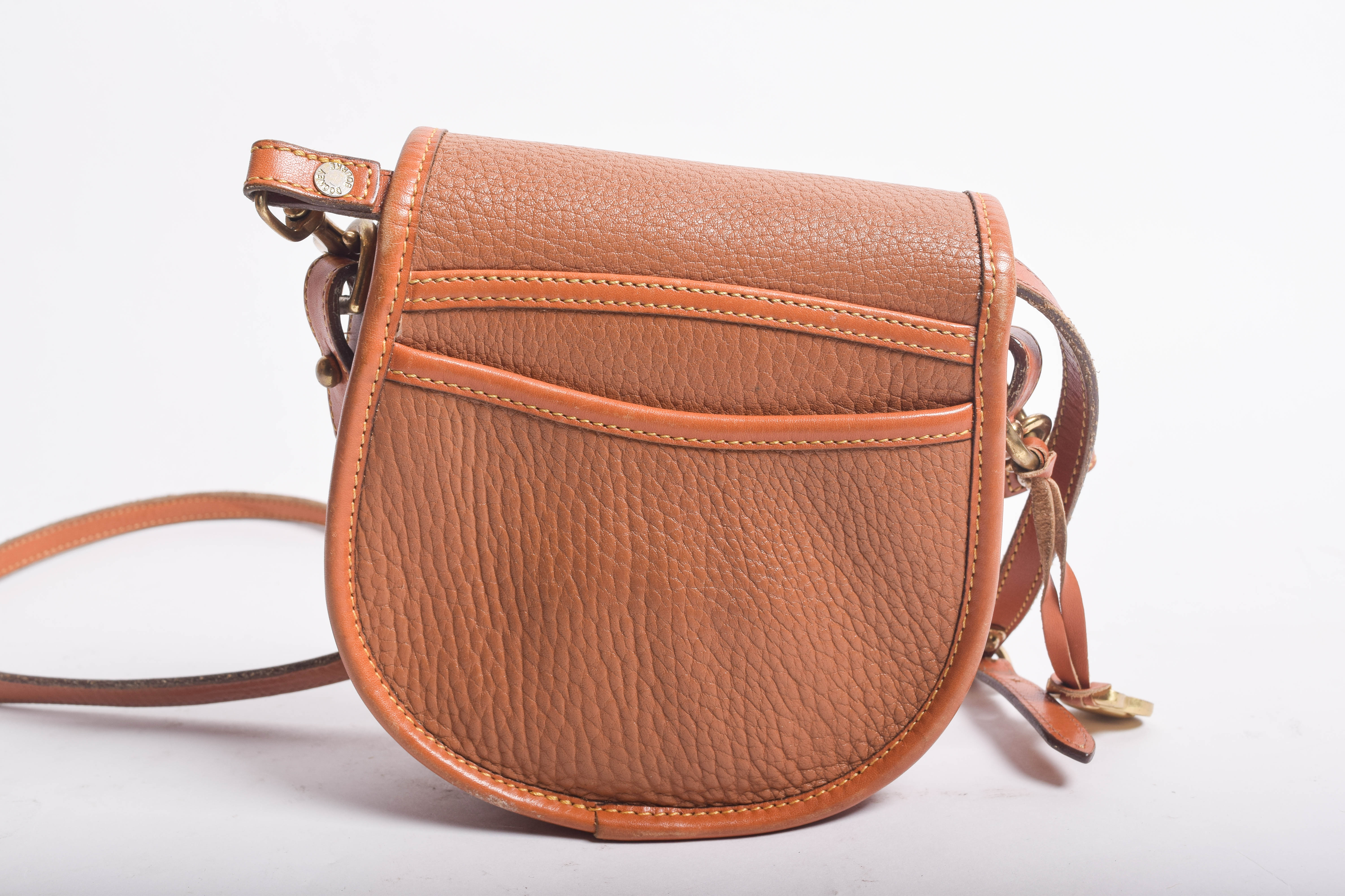 Assortment of Dooney & Bourke Handbags and Cole Haan Wallet