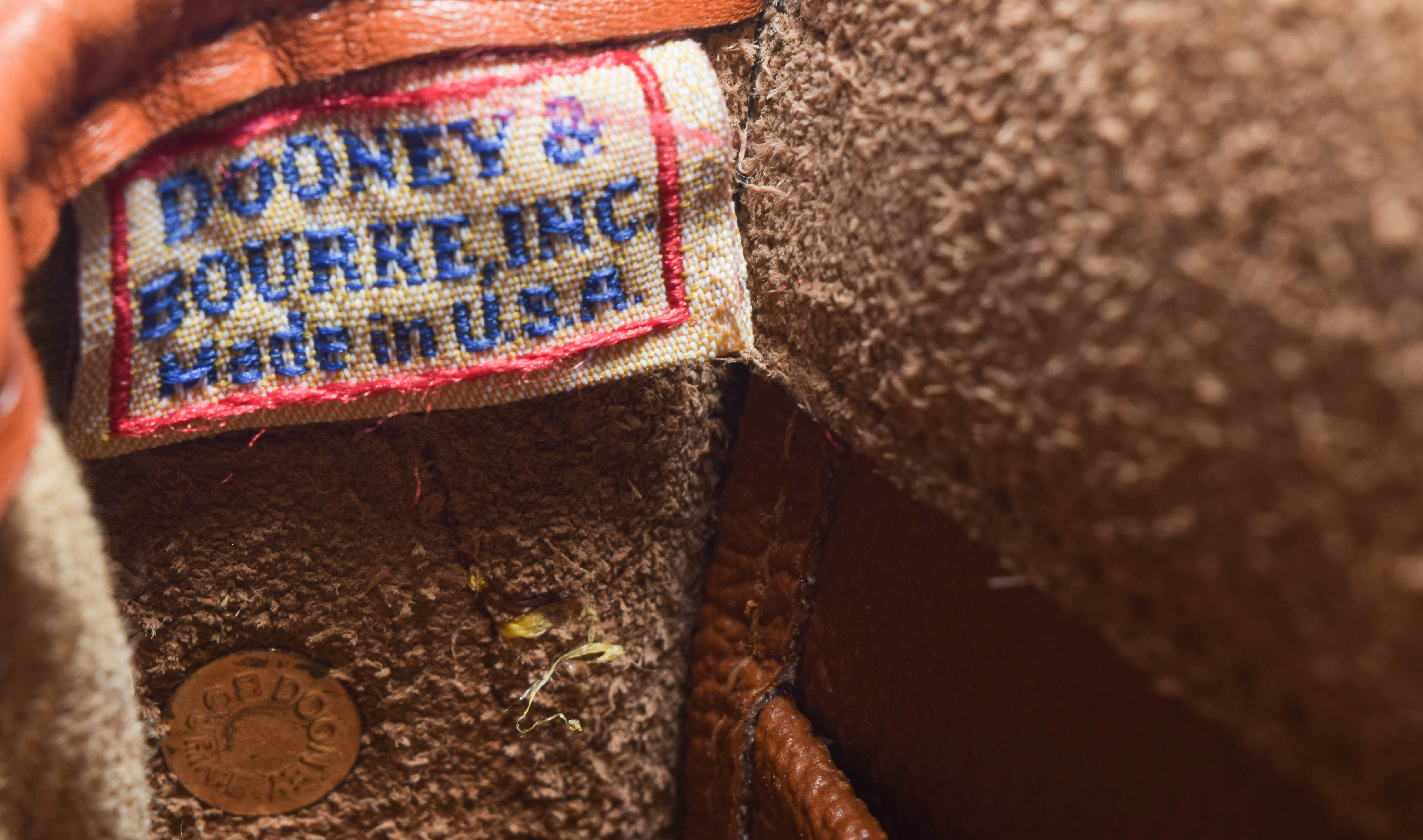 Assortment of Dooney & Bourke Handbags and Cole Haan Wallet