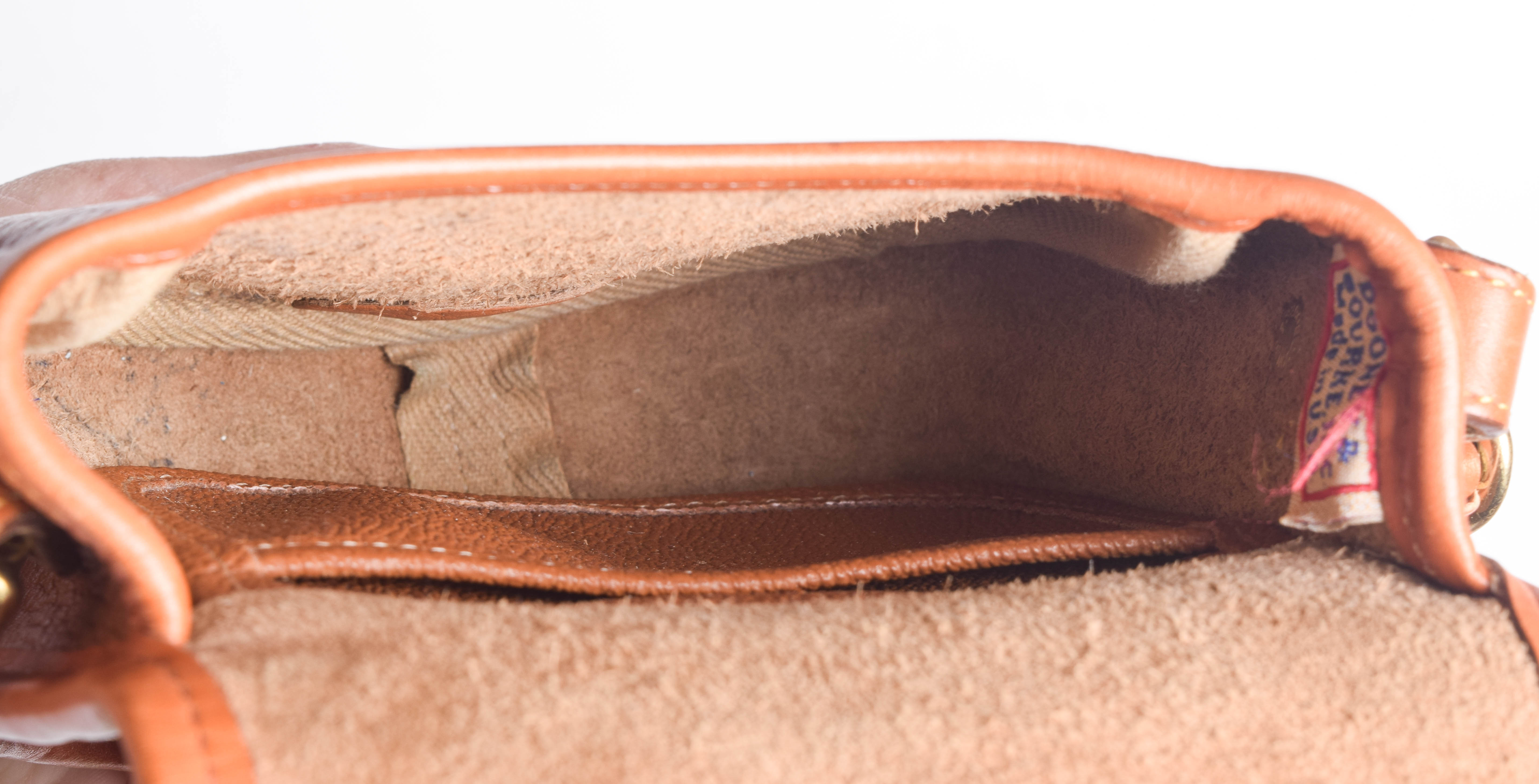 Assortment of Dooney & Bourke Handbags and Cole Haan Wallet