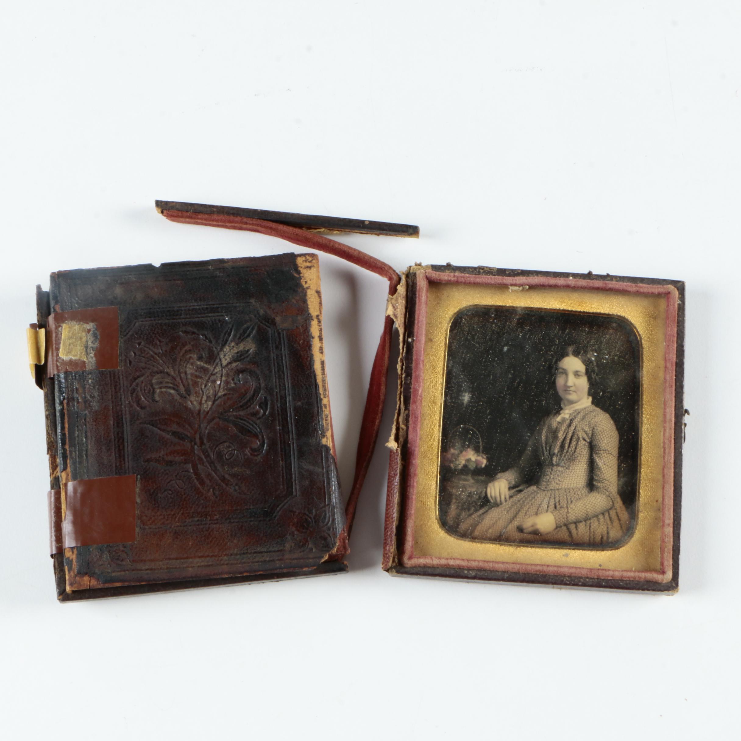 Antique Photographs of a Man and a Woman with Cases