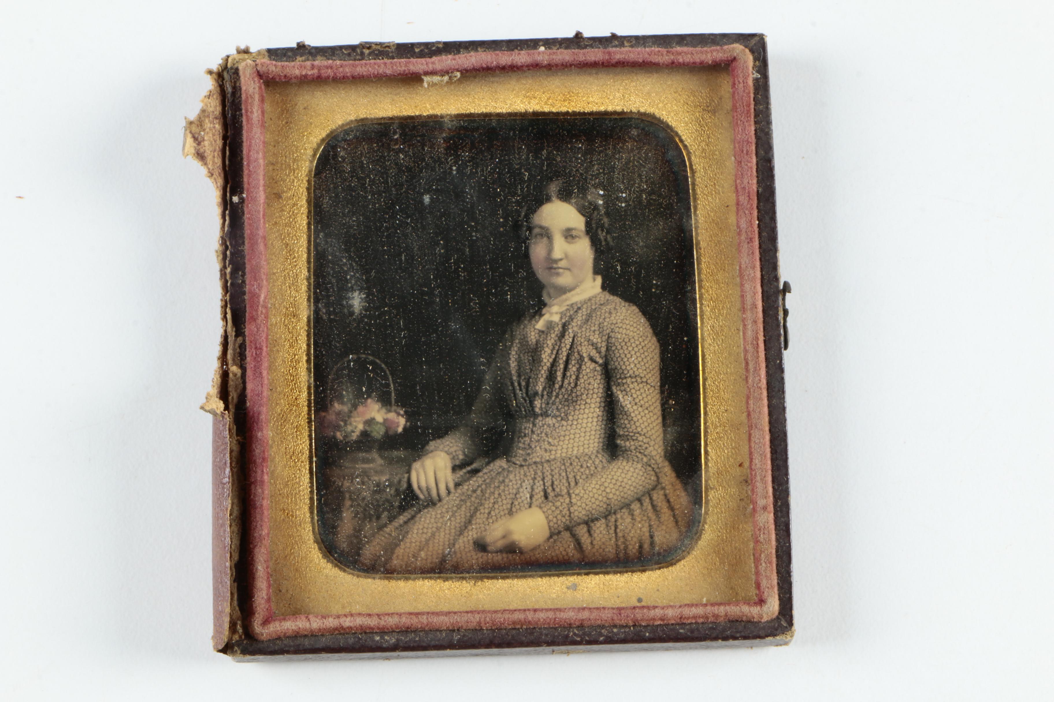 Antique Photographs of a Man and a Woman with Cases