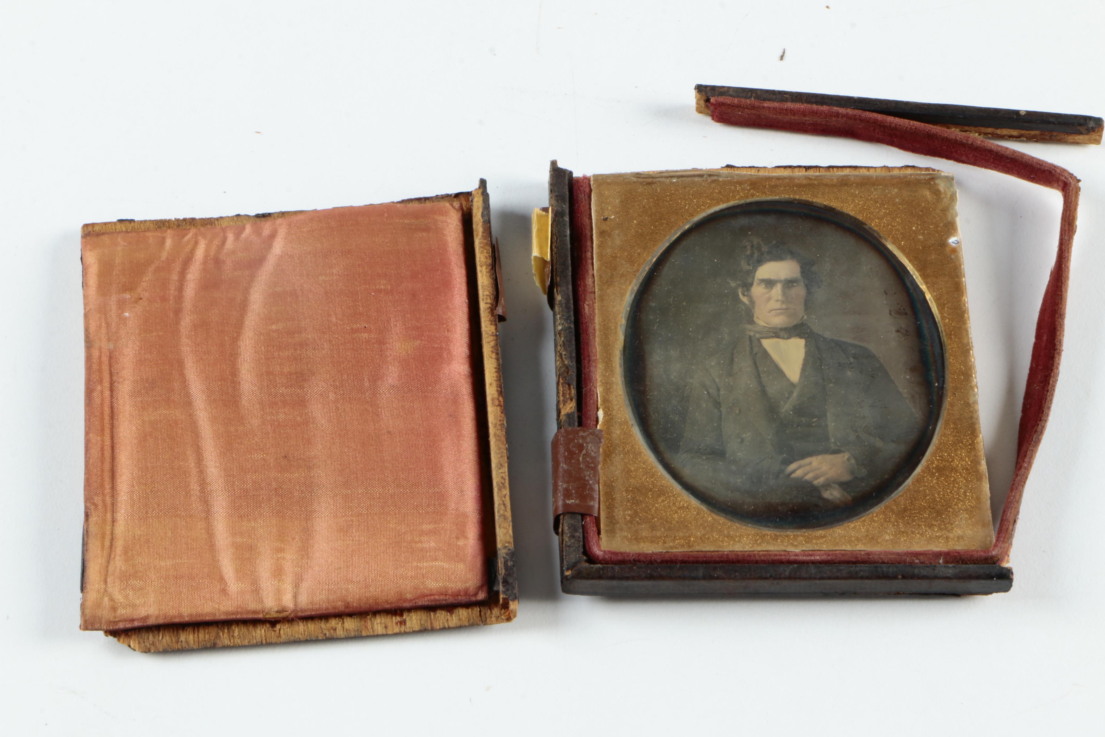 Antique Photographs of a Man and a Woman with Cases