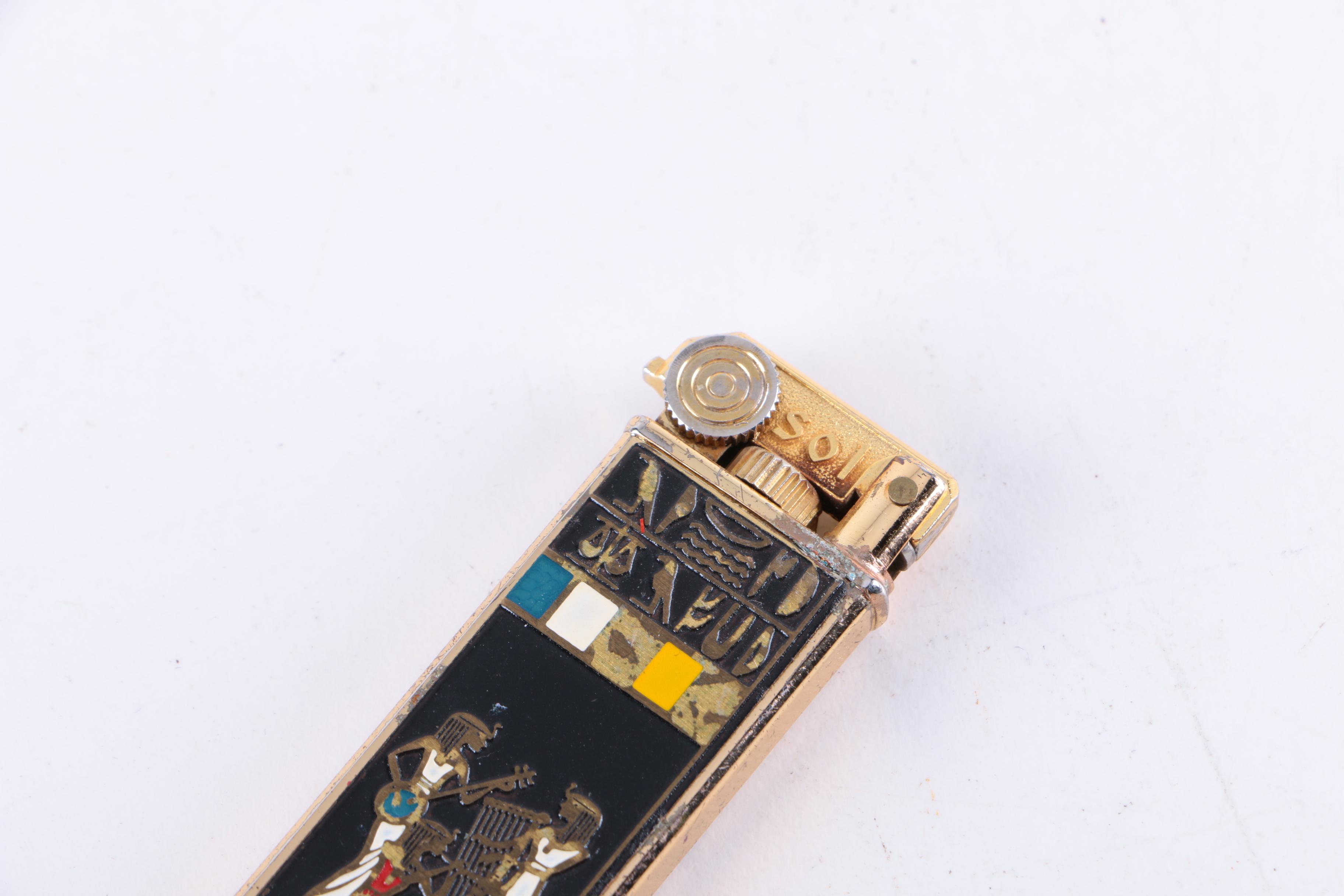 Gold-Toned Lighters Including Masai