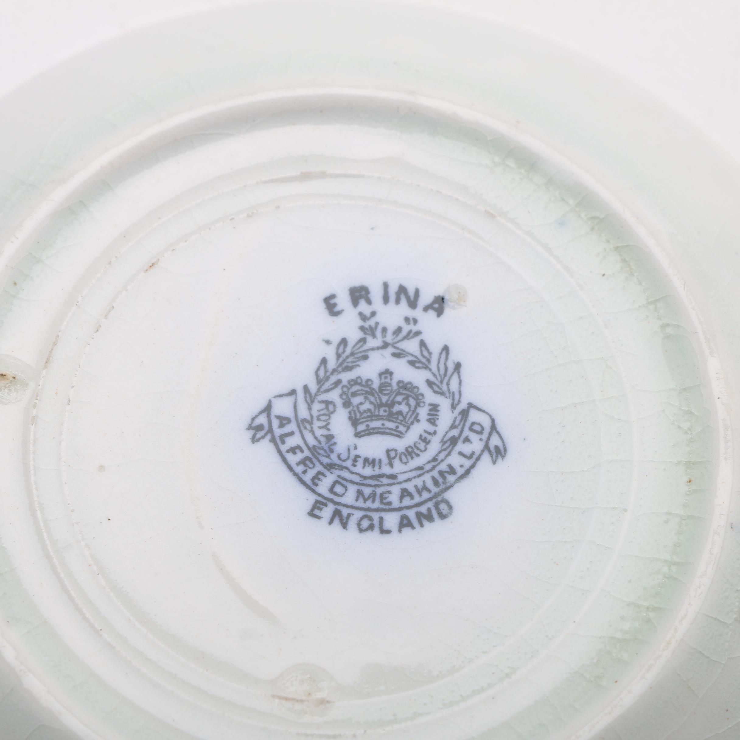 Twelve Porcelain Butter Pats In Glass Top Display Case