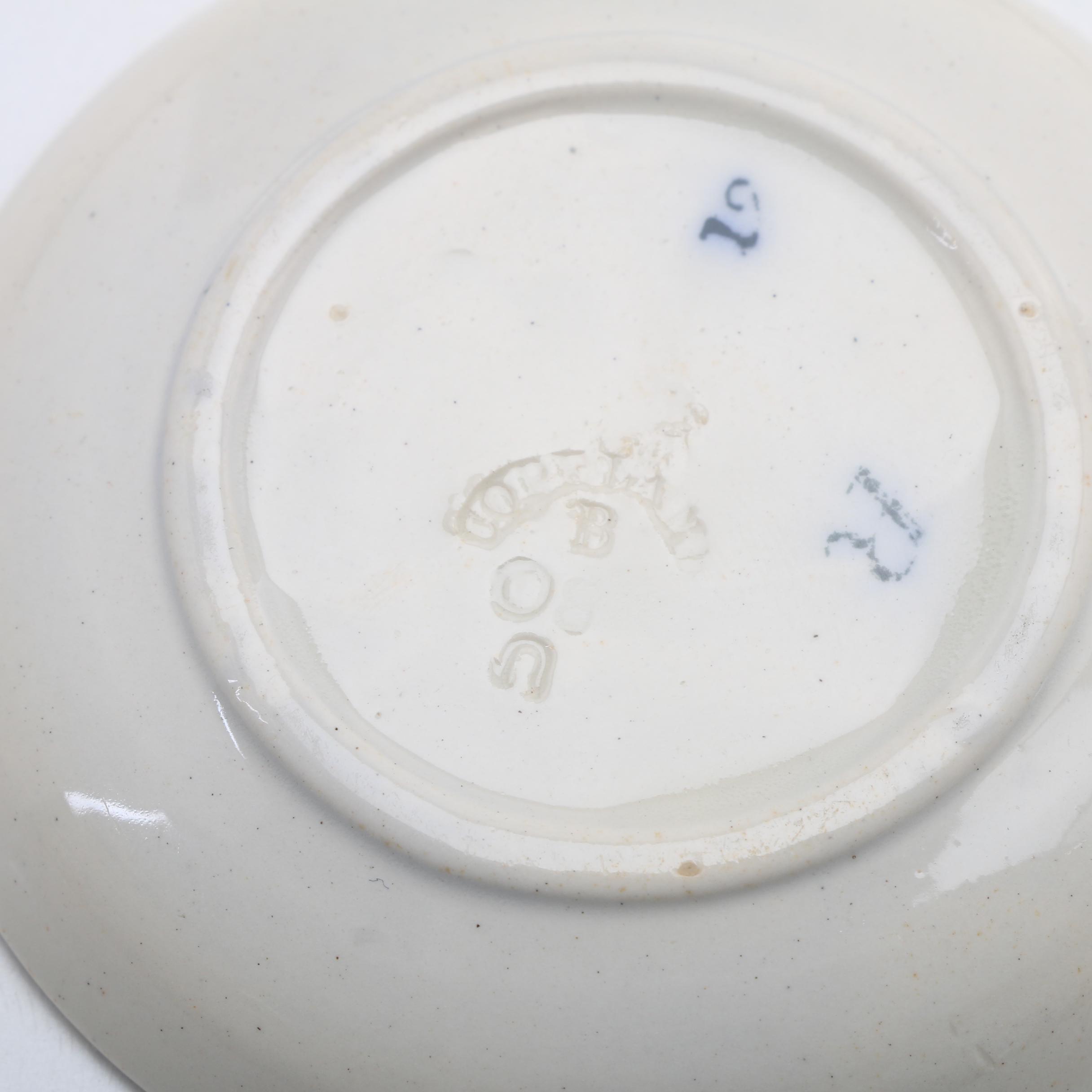 Twelve Porcelain Butter Pats In Glass Top Display Case