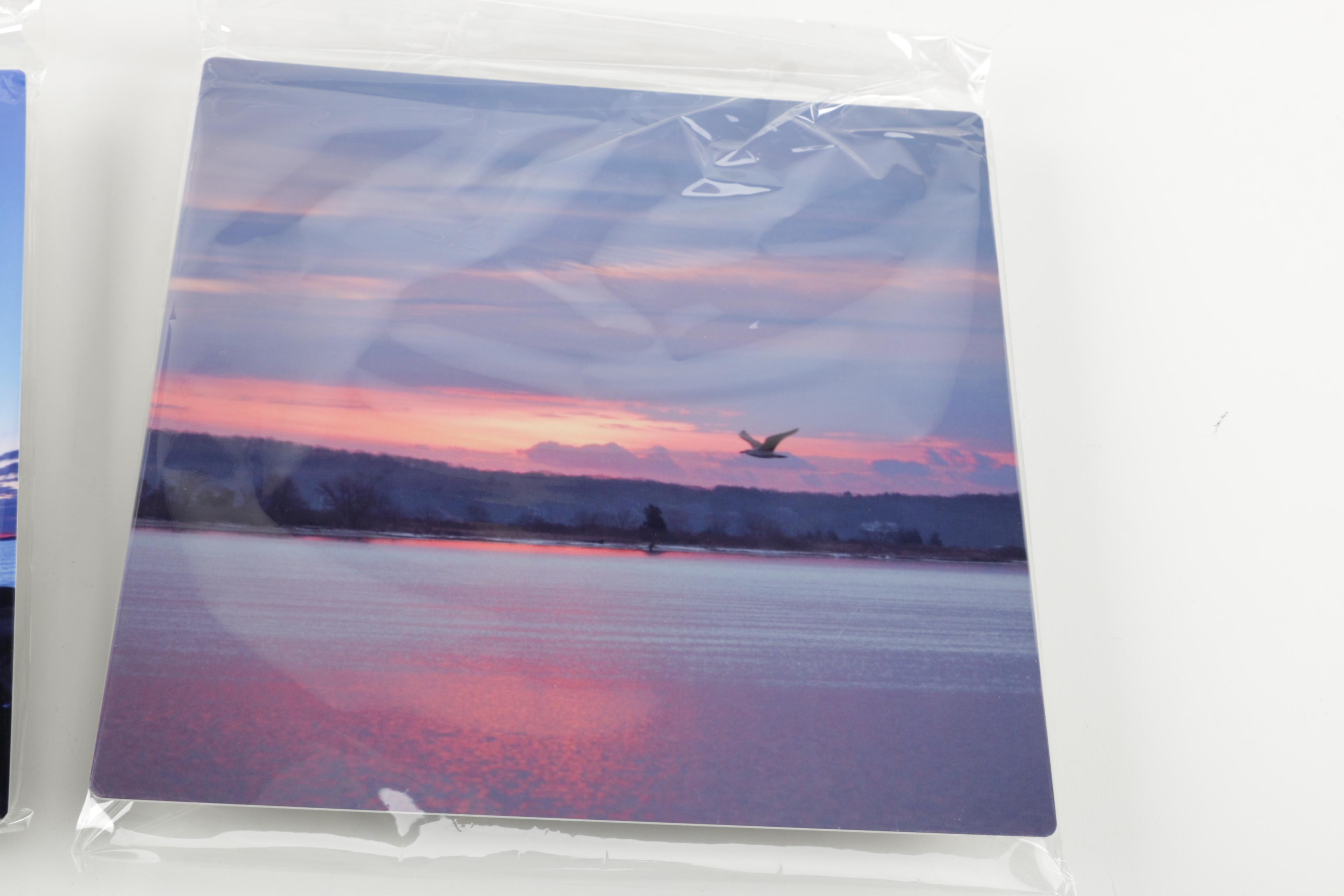 Digital Photographs of Sunrises Over Water