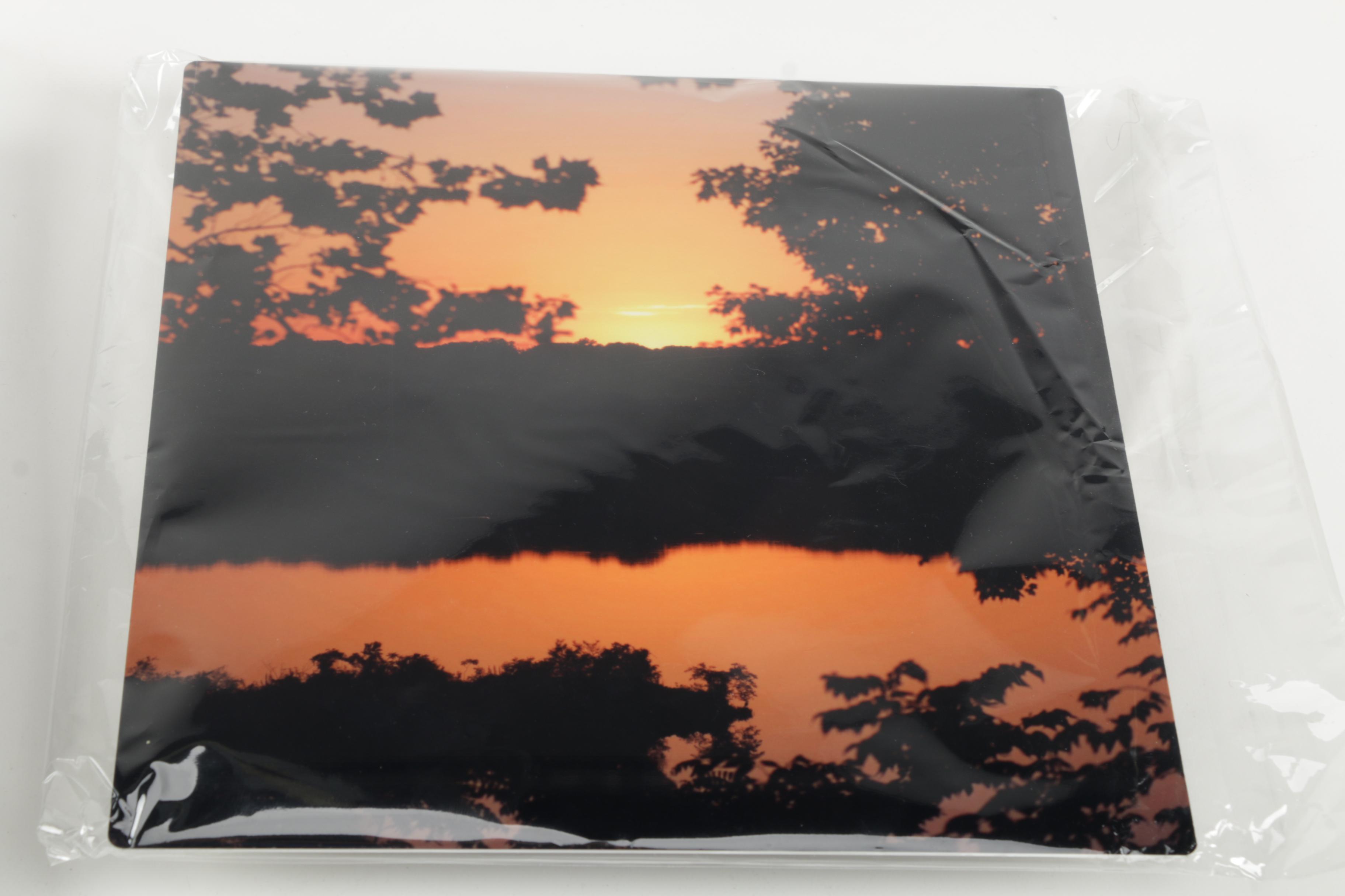 Digital Photographs of Sunsets Over Water