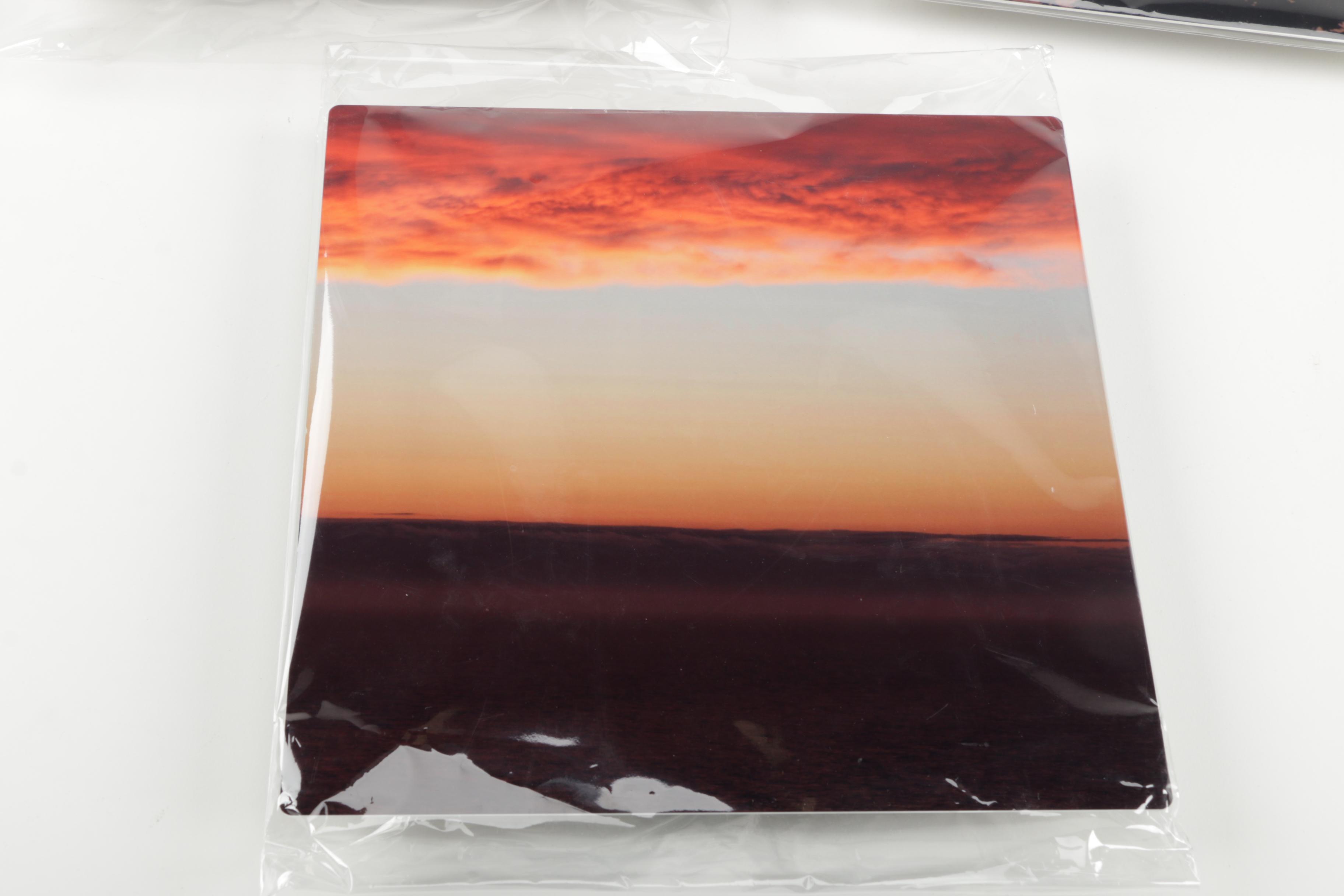 Digital Photographs of Sunsets Over Water