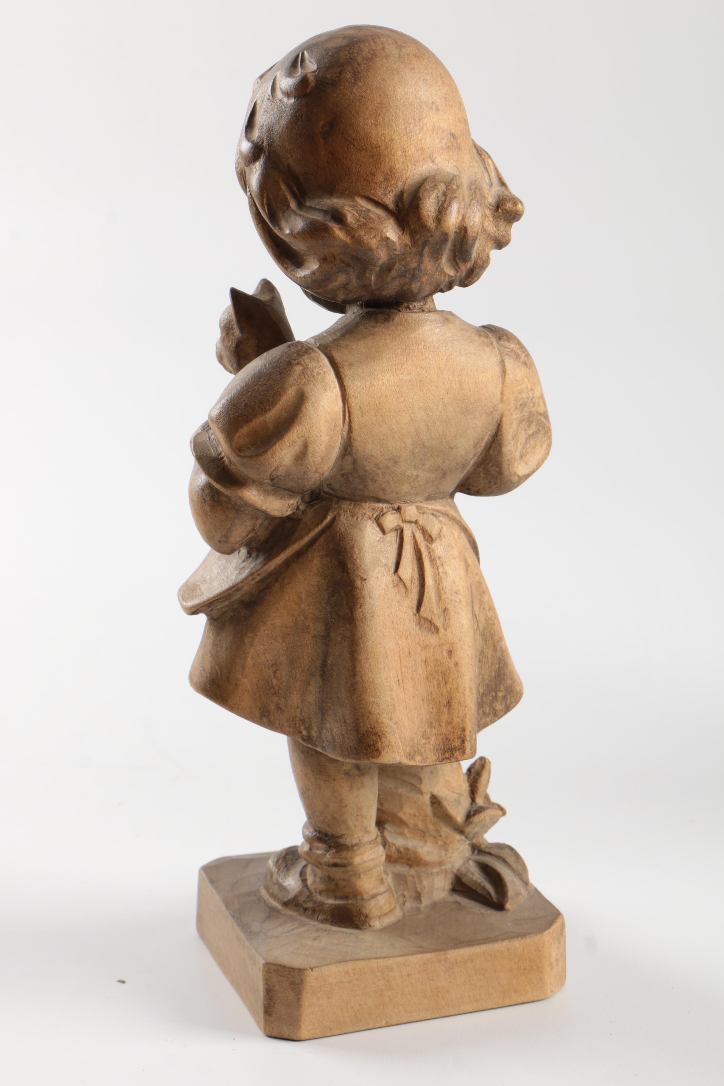 Carved Wood Figurines Featuring Children