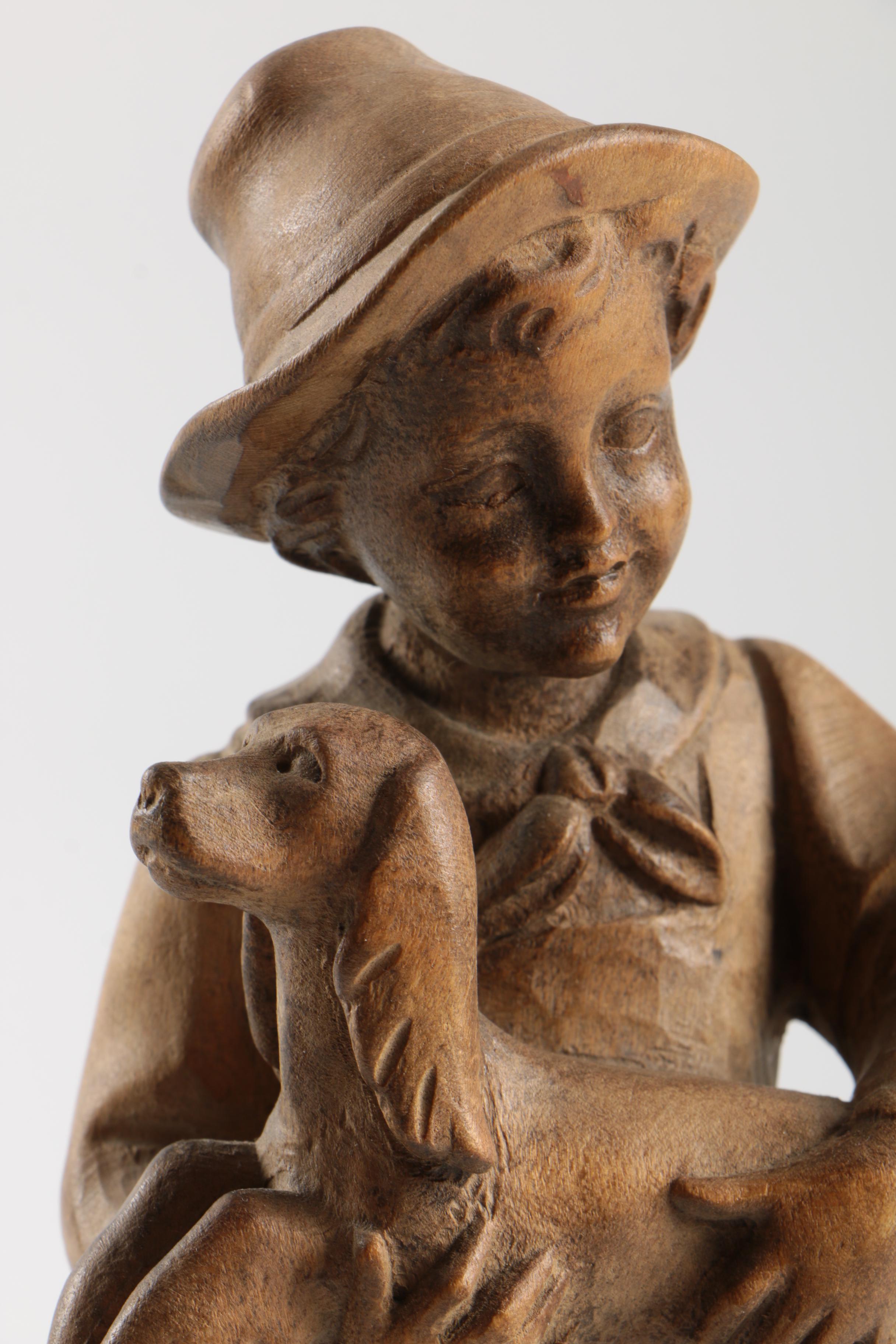 Carved Wood Figurines Featuring Children