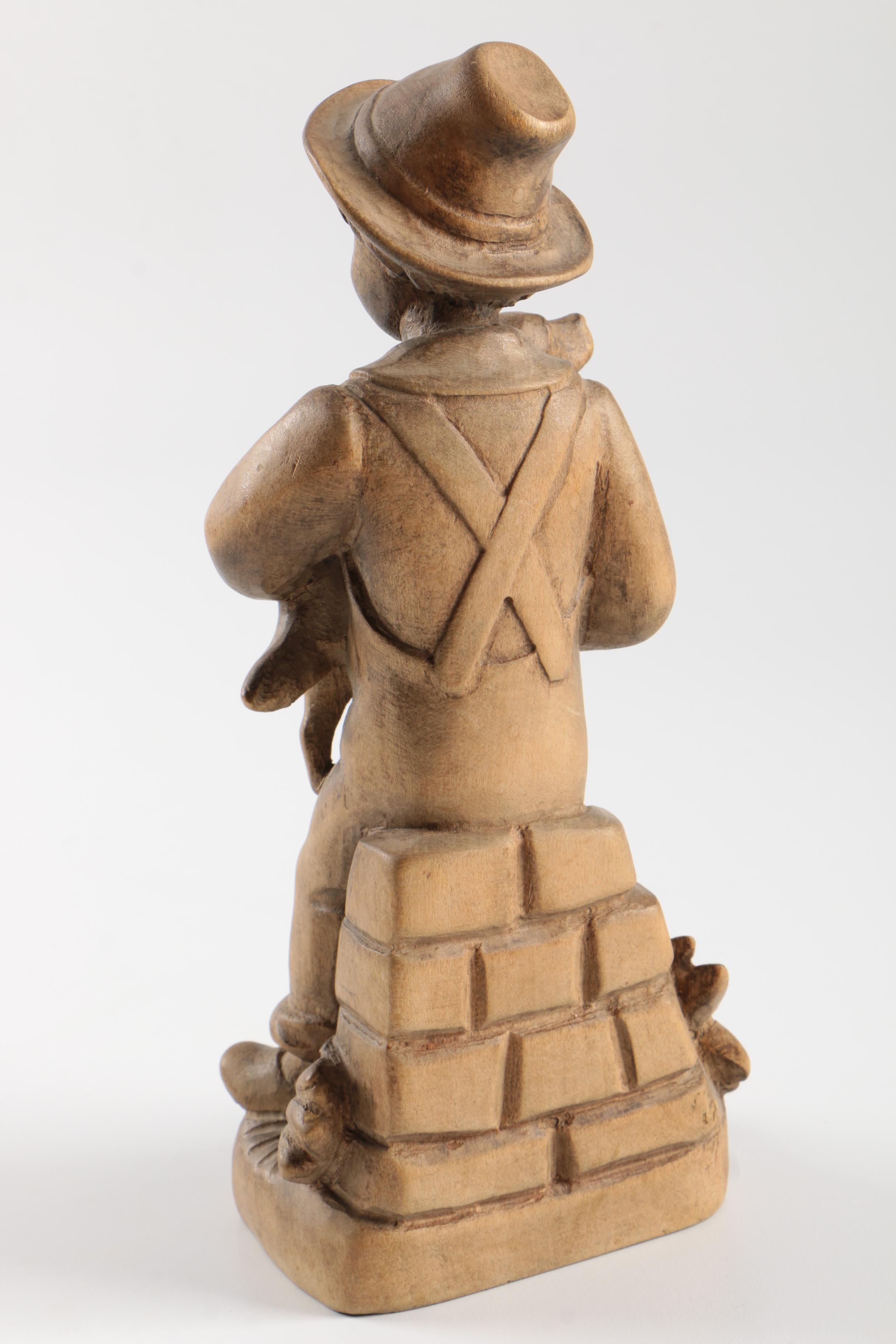 Carved Wood Figurines Featuring Children