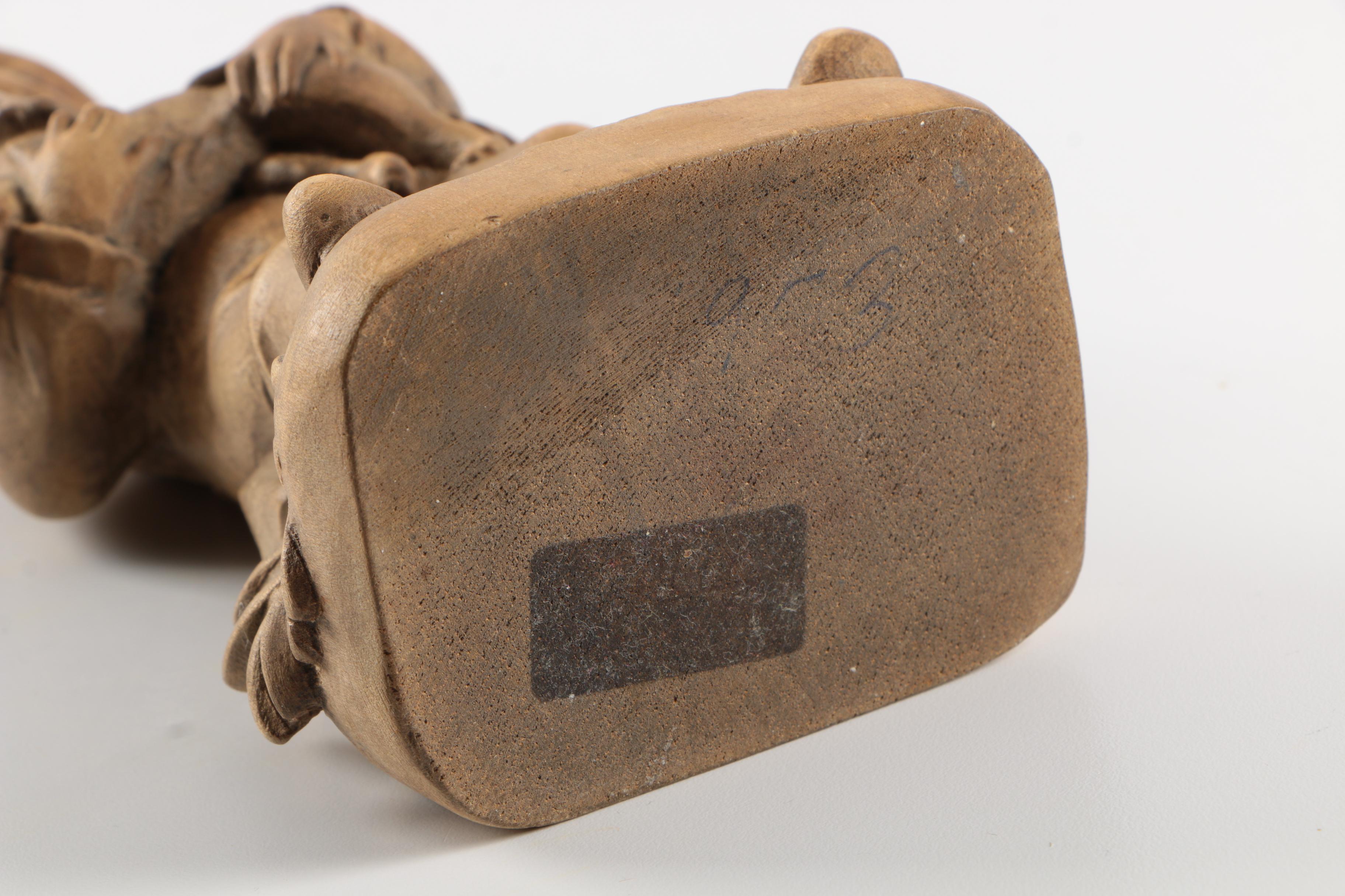 Carved Wood Figurines Featuring Children