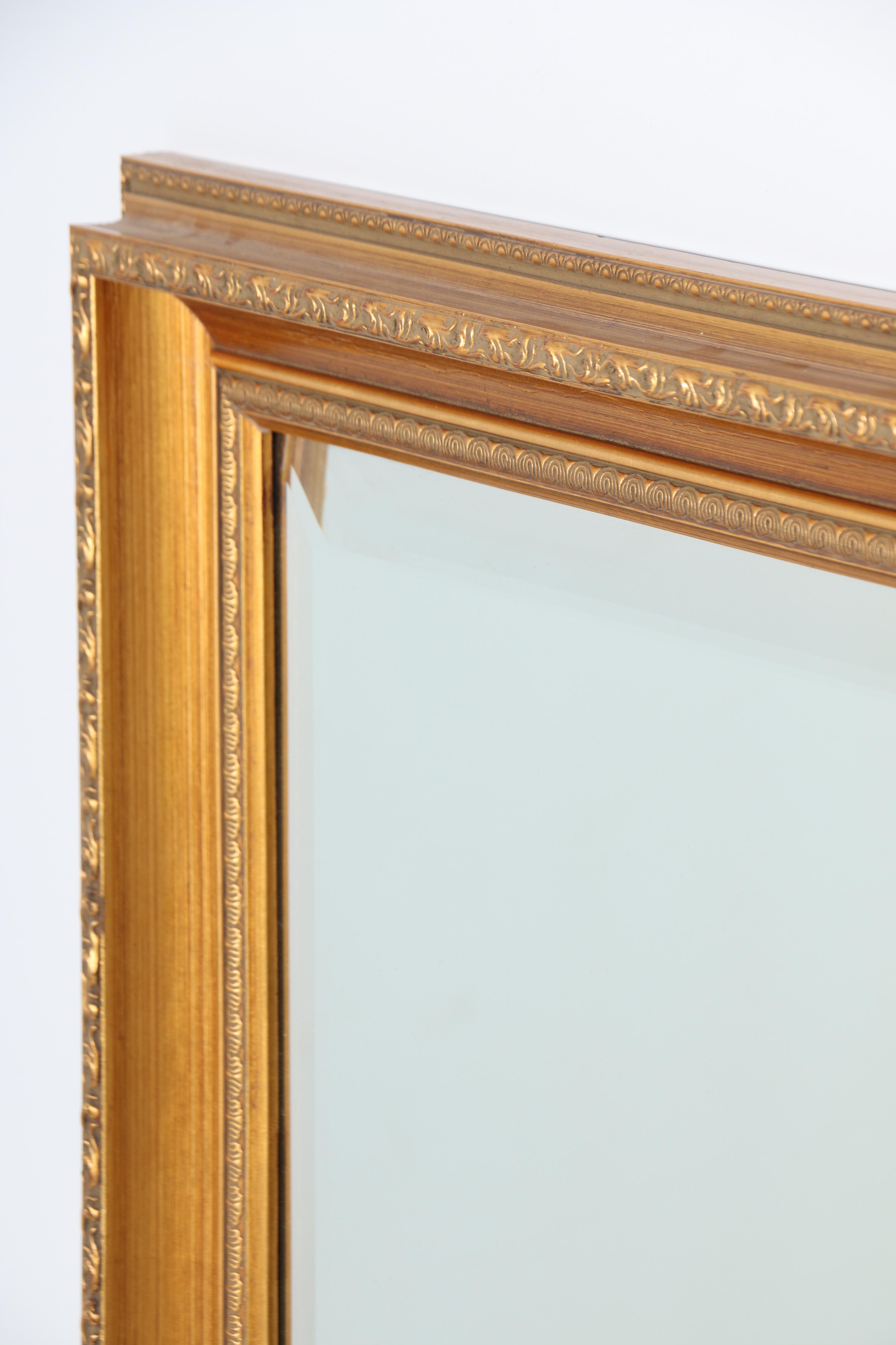 Ornately Framed Beveled Wall Mirror