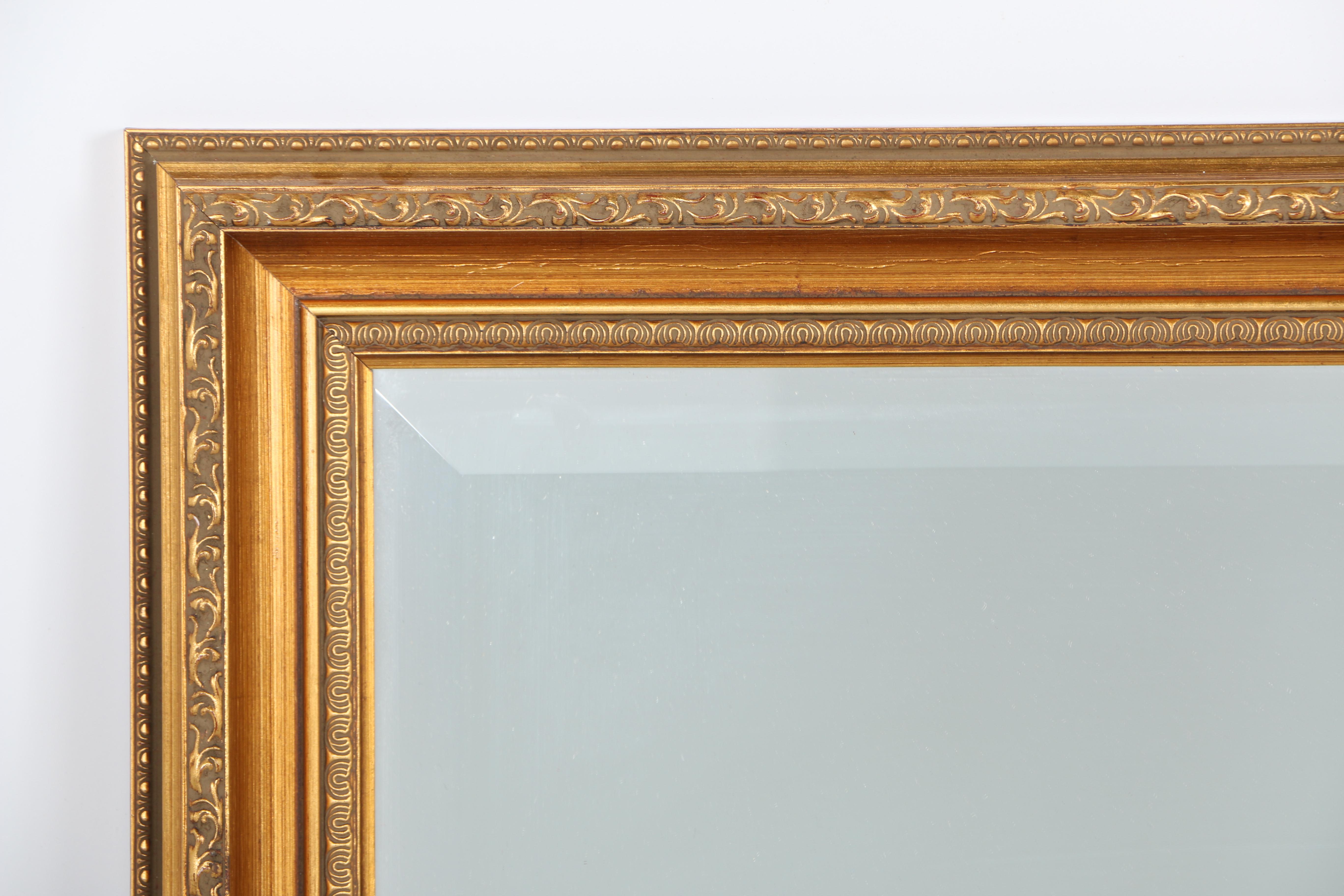 Ornately Framed Beveled Wall Mirror