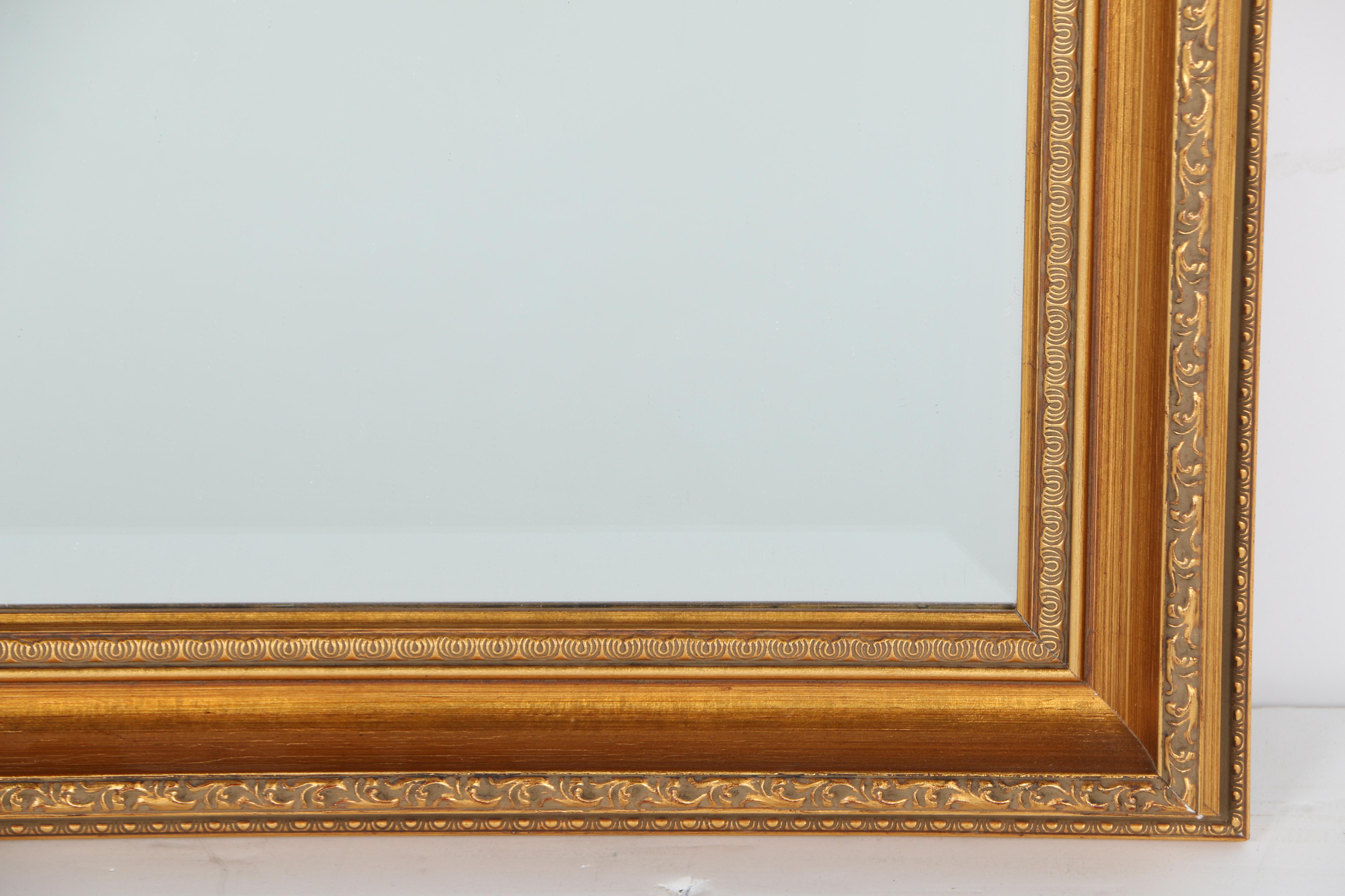 Ornately Framed Beveled Wall Mirror