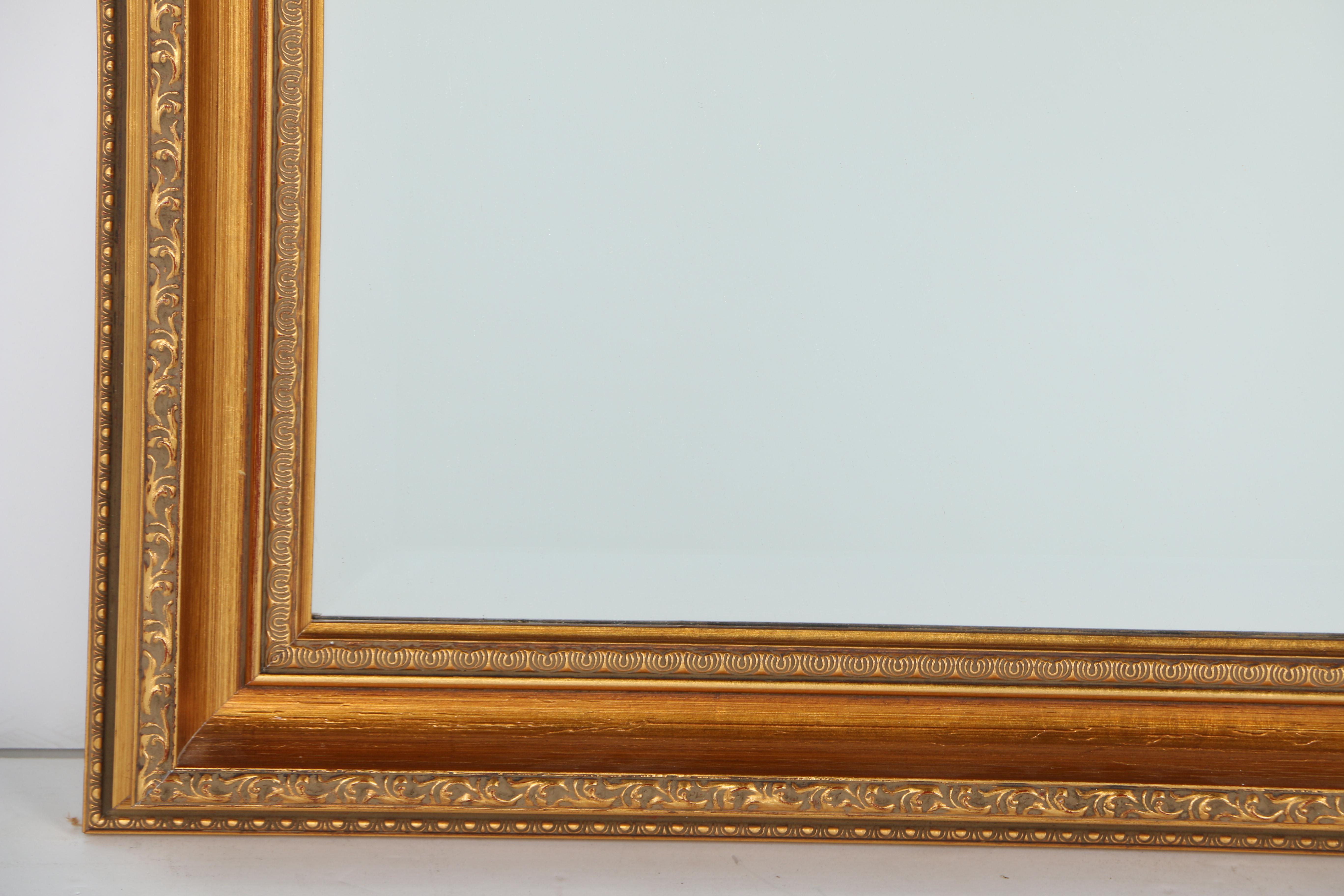 Ornately Framed Beveled Wall Mirror