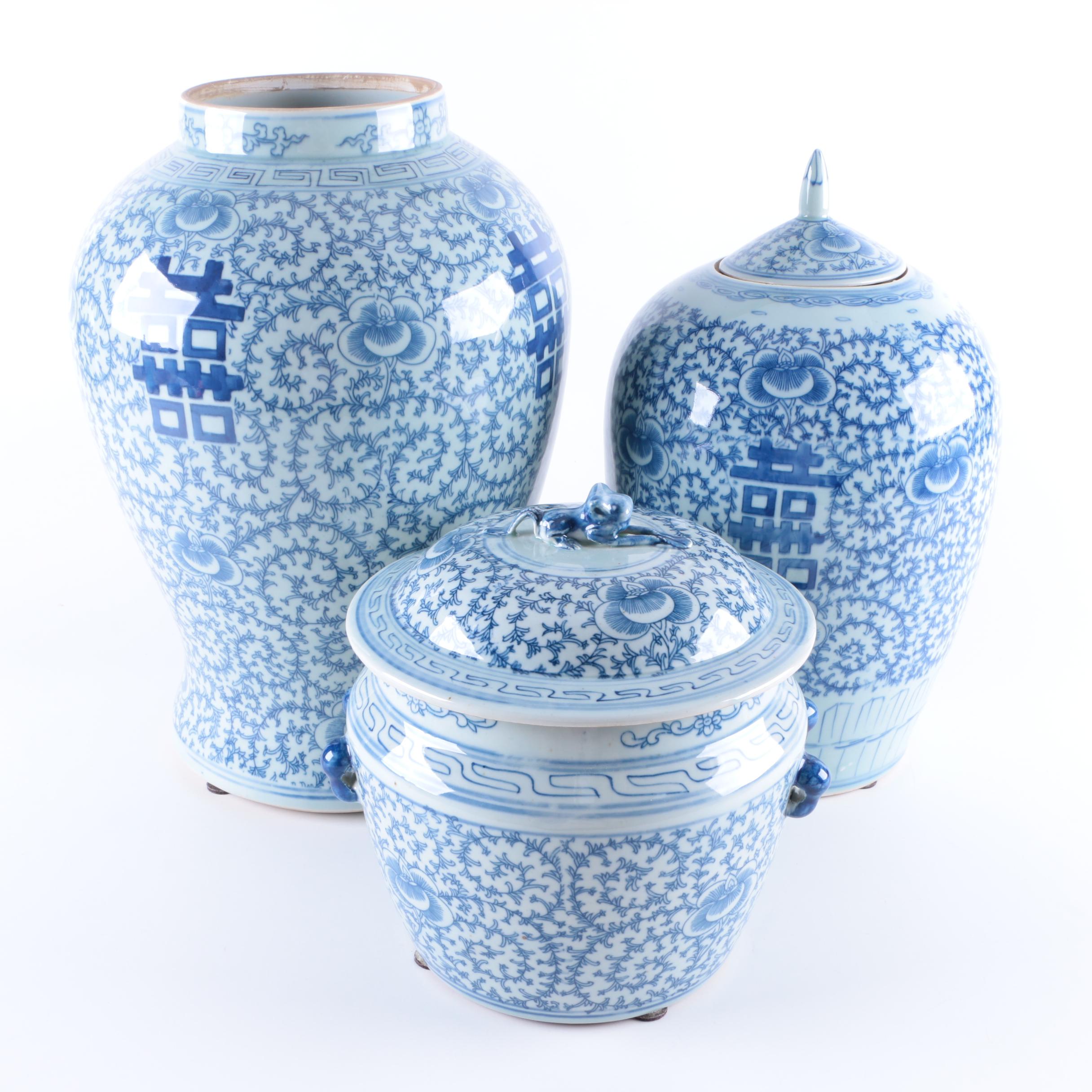 A Set of Three Chinese Blue and White Floral Motif Vases