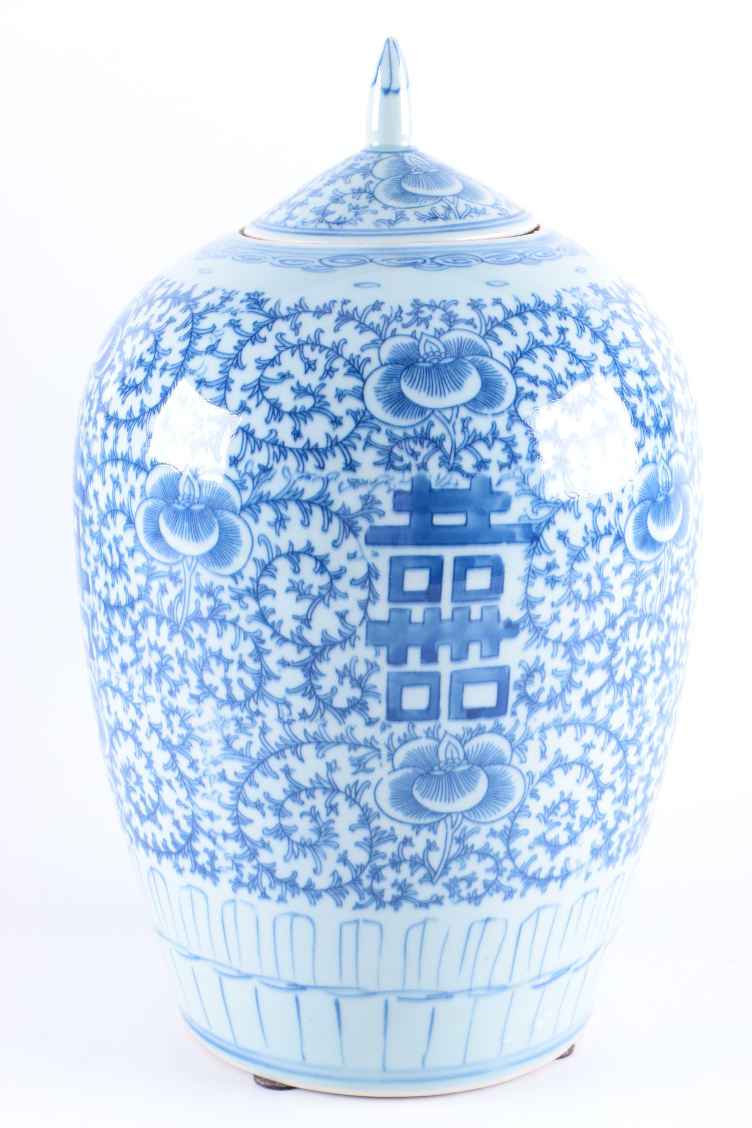 A Set of Three Chinese Blue and White Floral Motif Vases