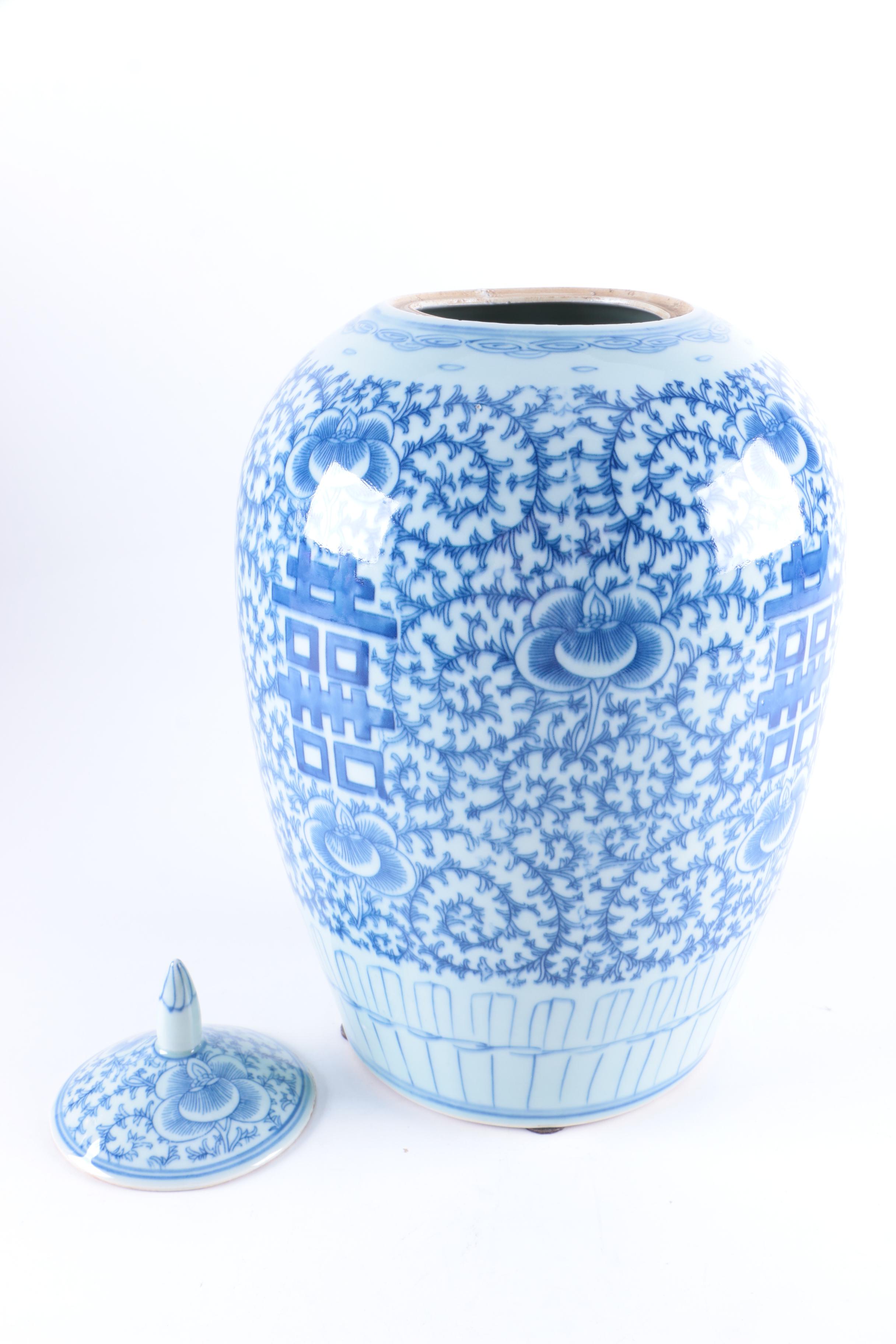 A Set of Three Chinese Blue and White Floral Motif Vases