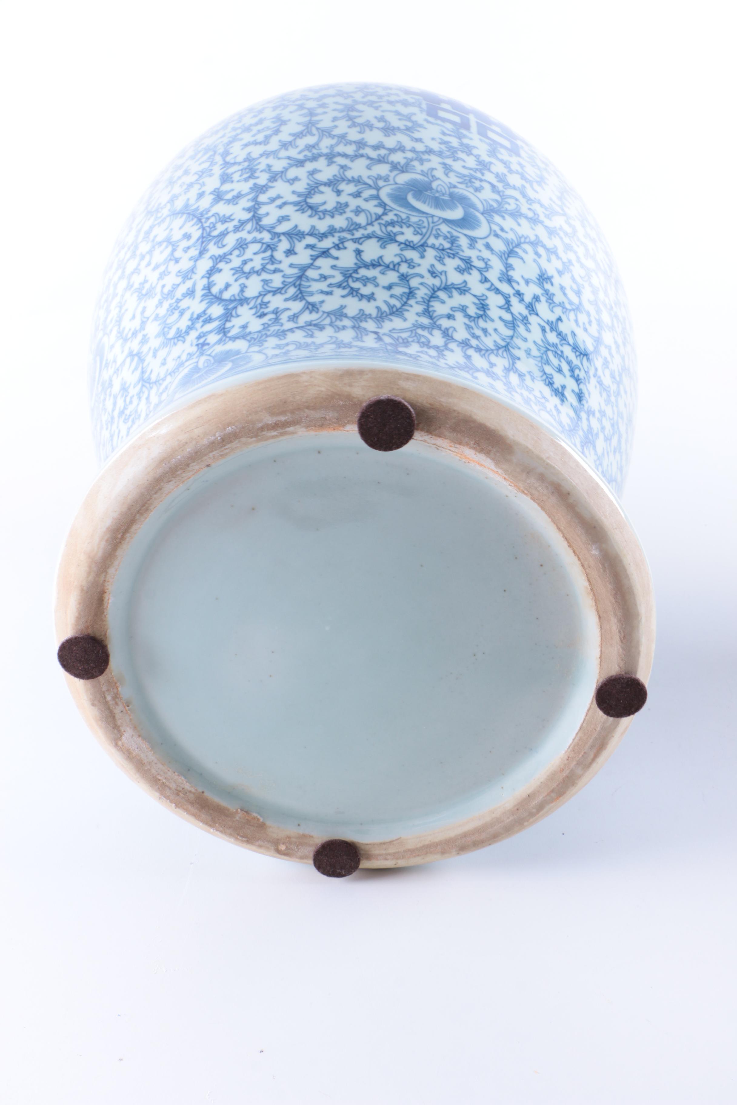 A Set of Three Chinese Blue and White Floral Motif Vases