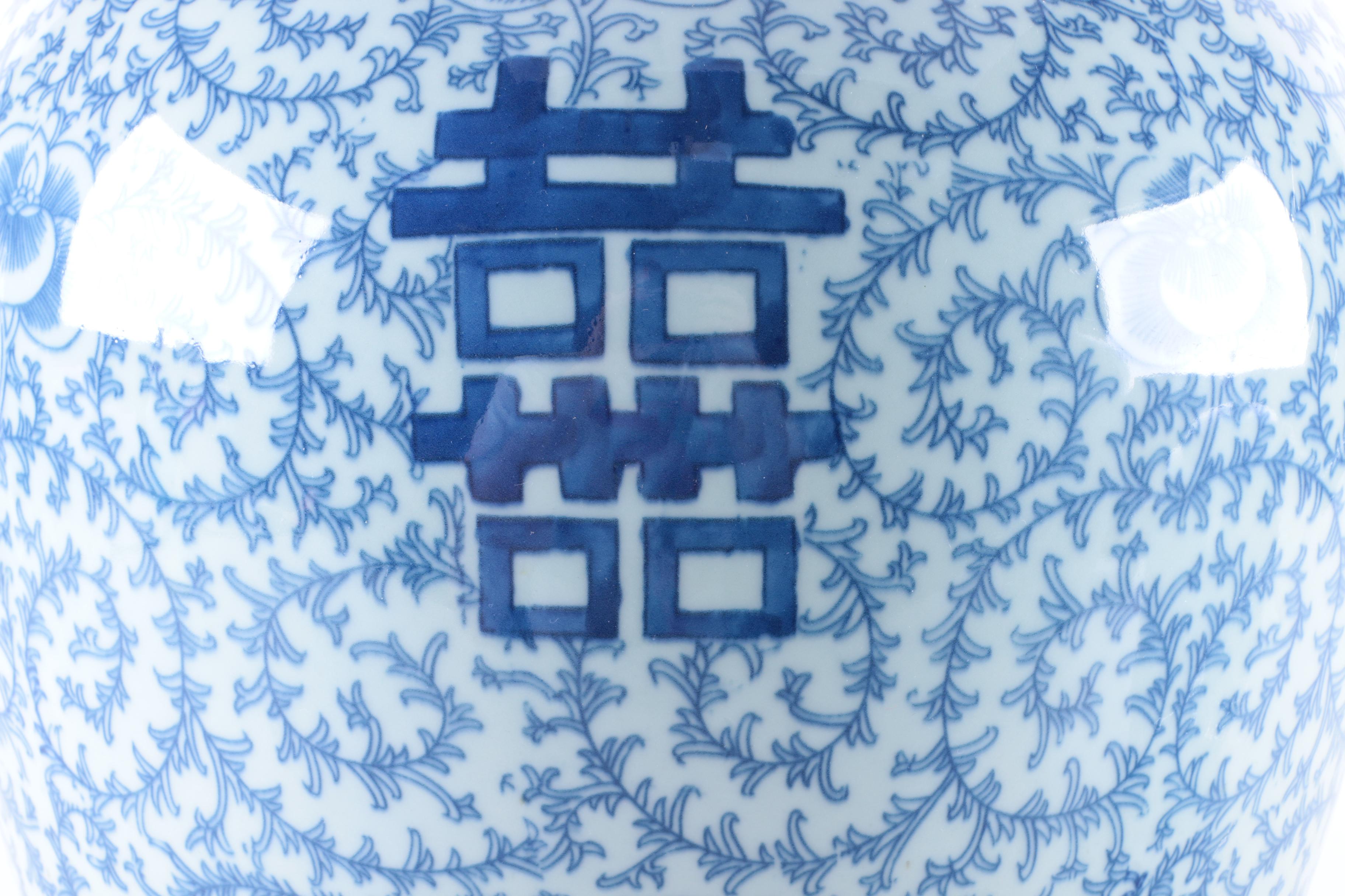 A Set of Three Chinese Blue and White Floral Motif Vases