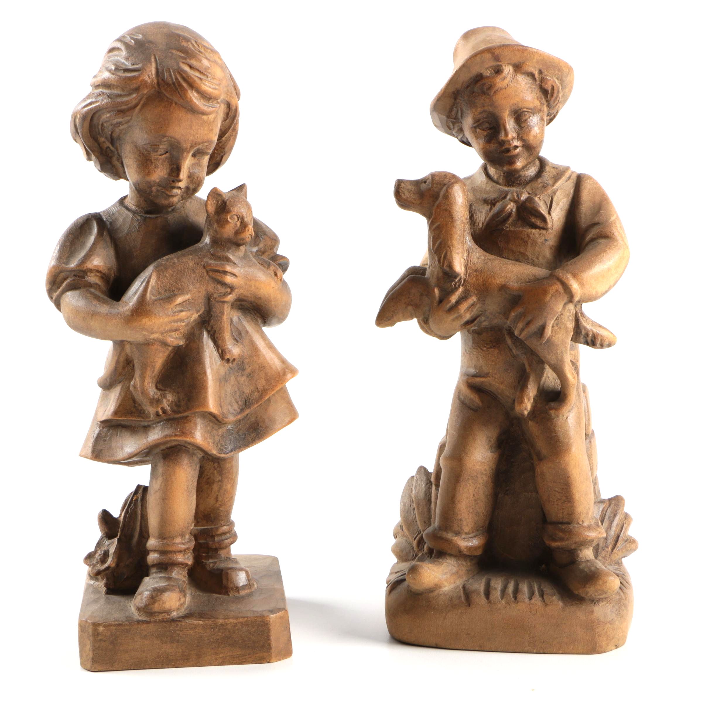 Carved Wood Figurines Featuring Children