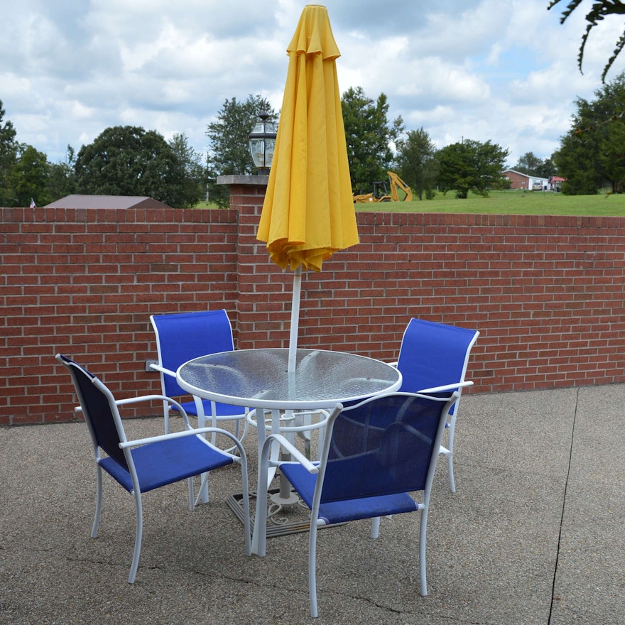 Patio Table with Yellow Umbrella and Four Chairs