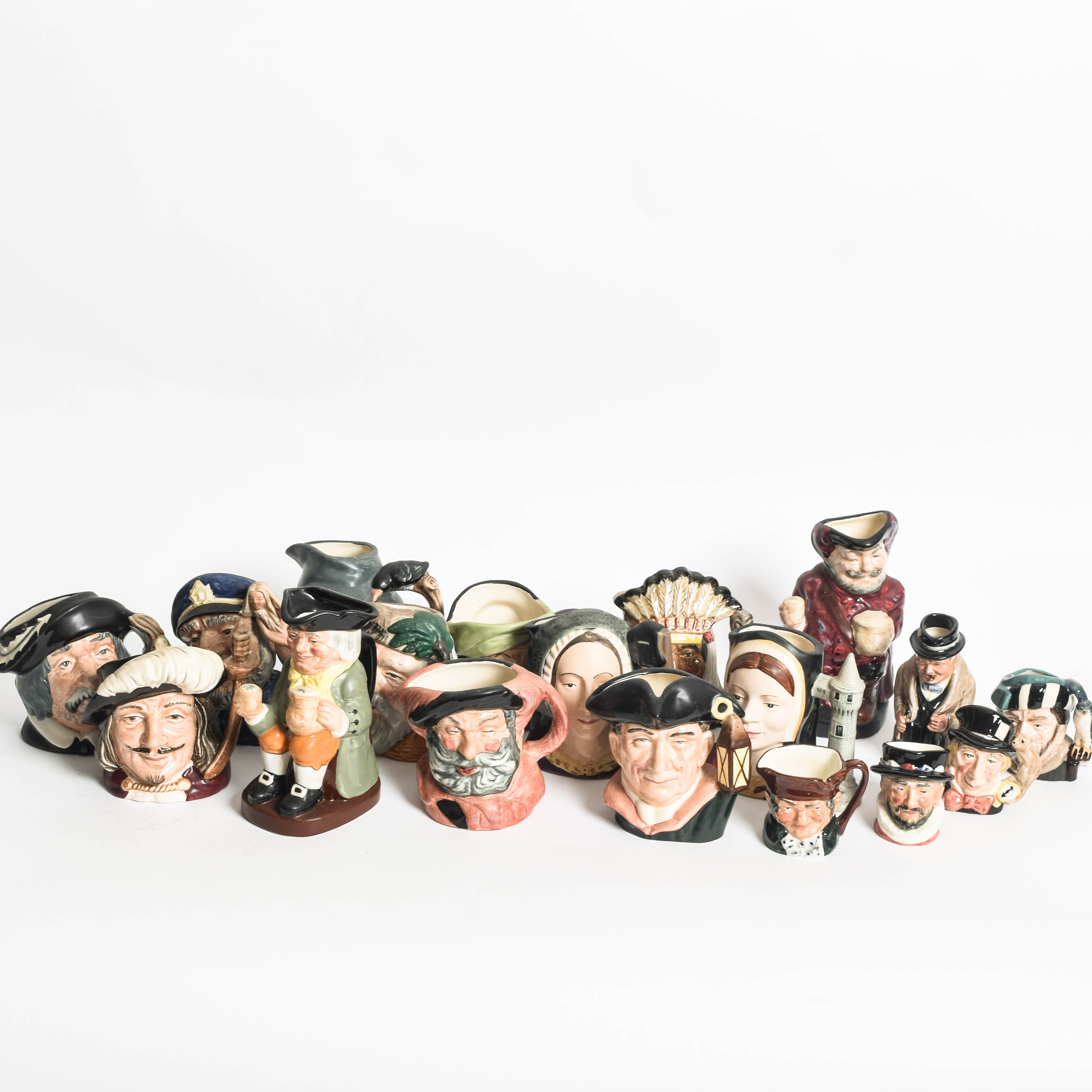 Generous Assortment of  of Royal Doulton Toby Jugs and Character Mugs