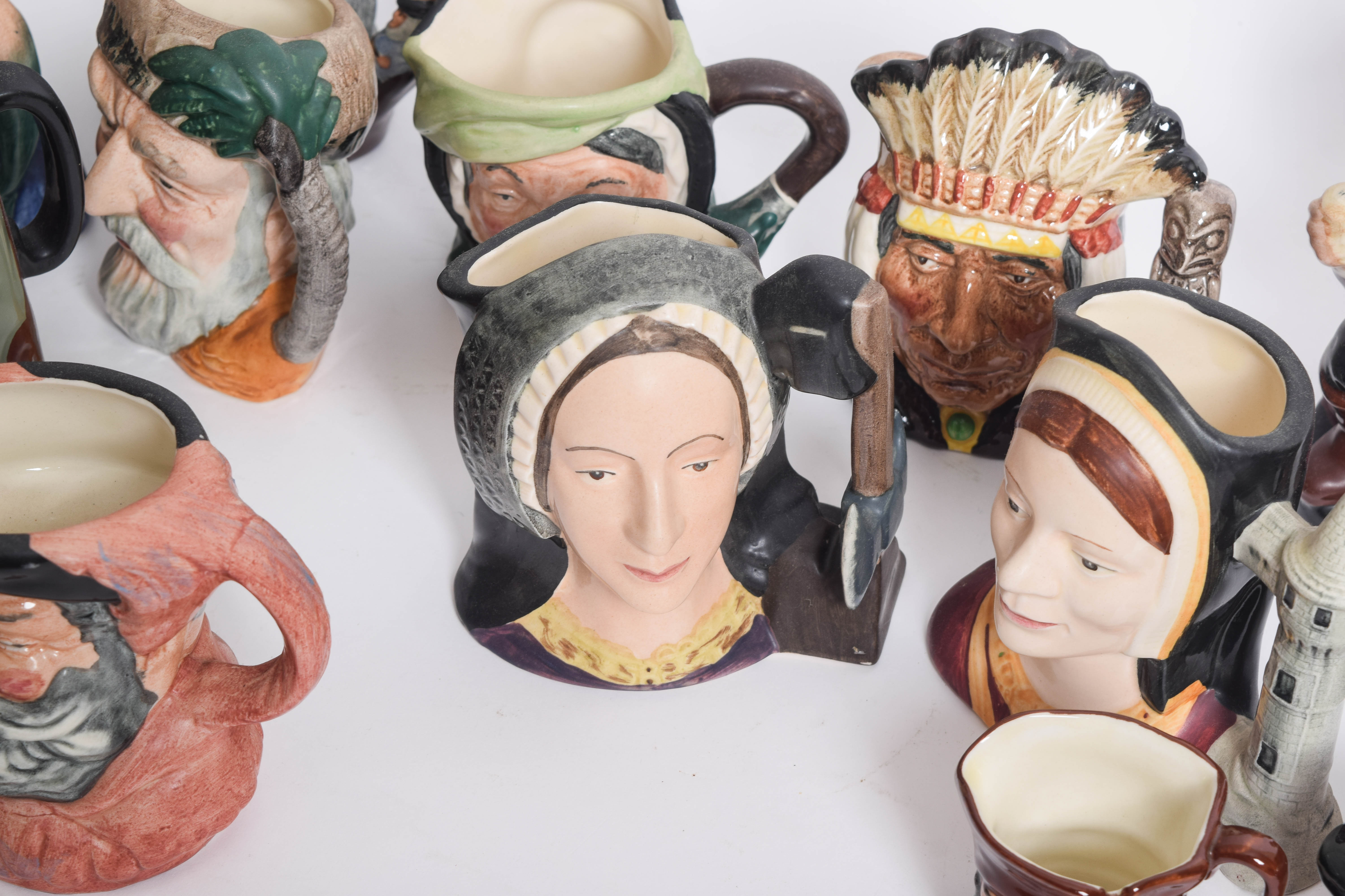 Generous Assortment of  of Royal Doulton Toby Jugs and Character Mugs
