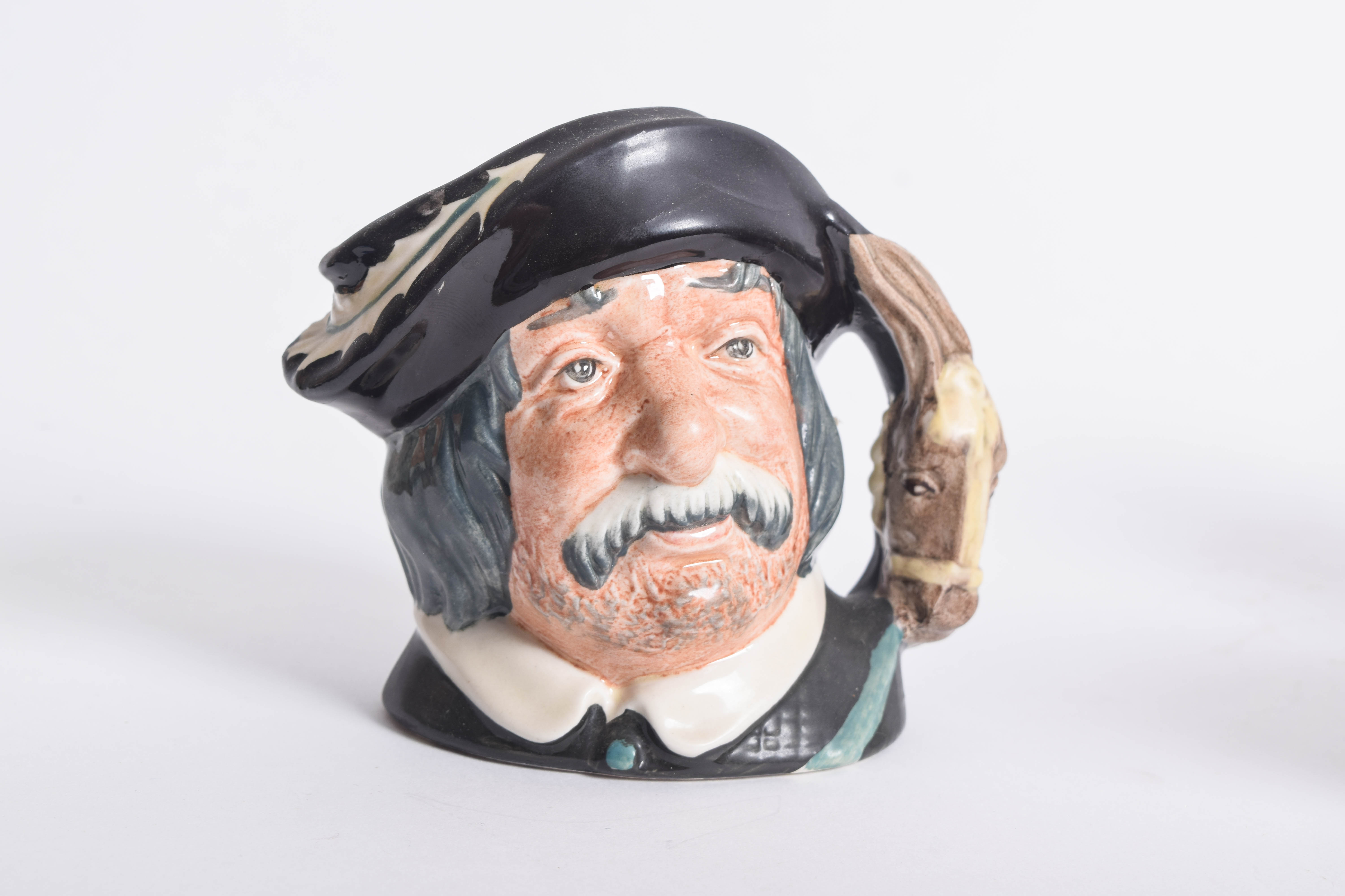 Generous Assortment of  of Royal Doulton Toby Jugs and Character Mugs