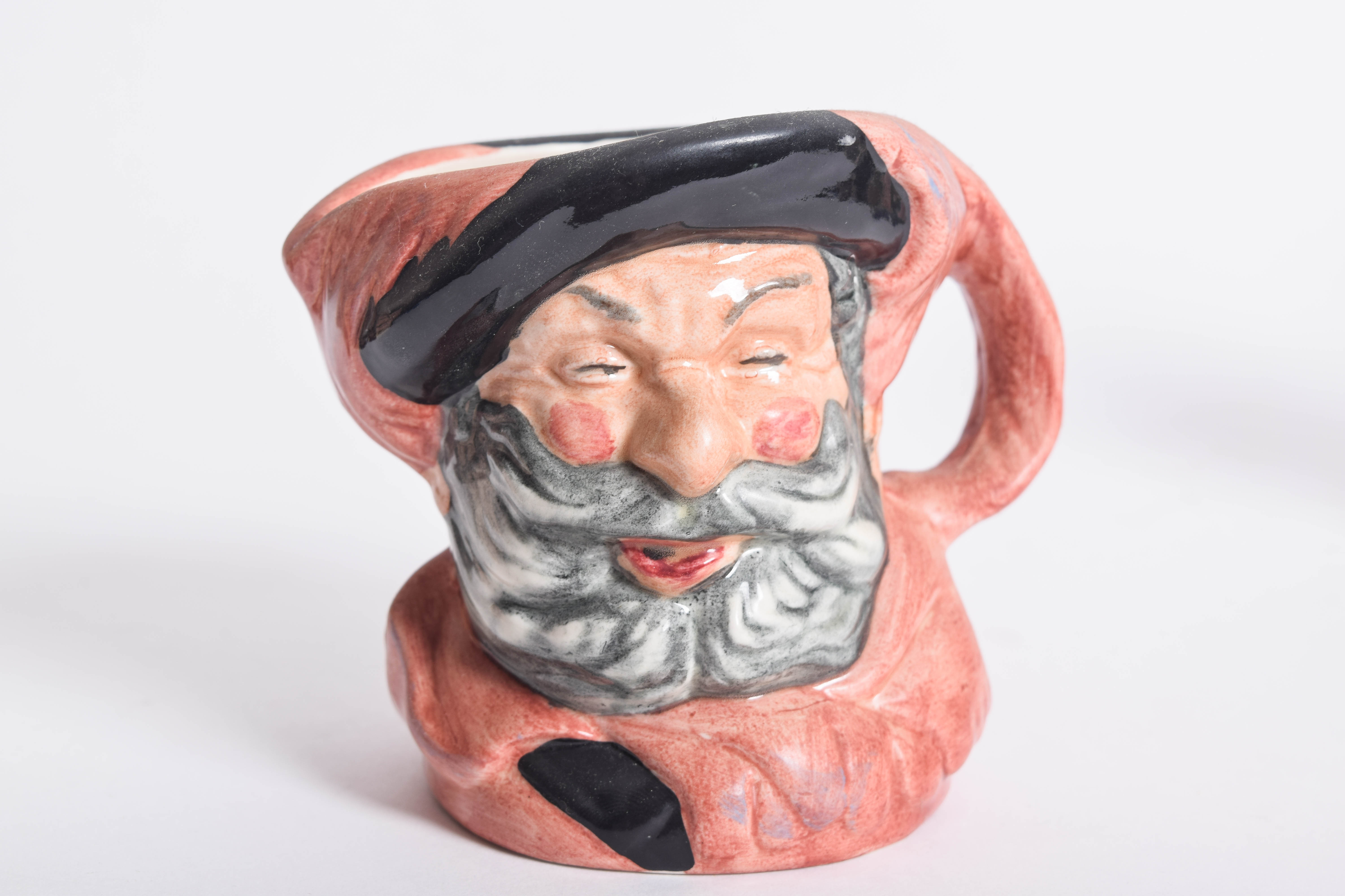 Generous Assortment of  of Royal Doulton Toby Jugs and Character Mugs