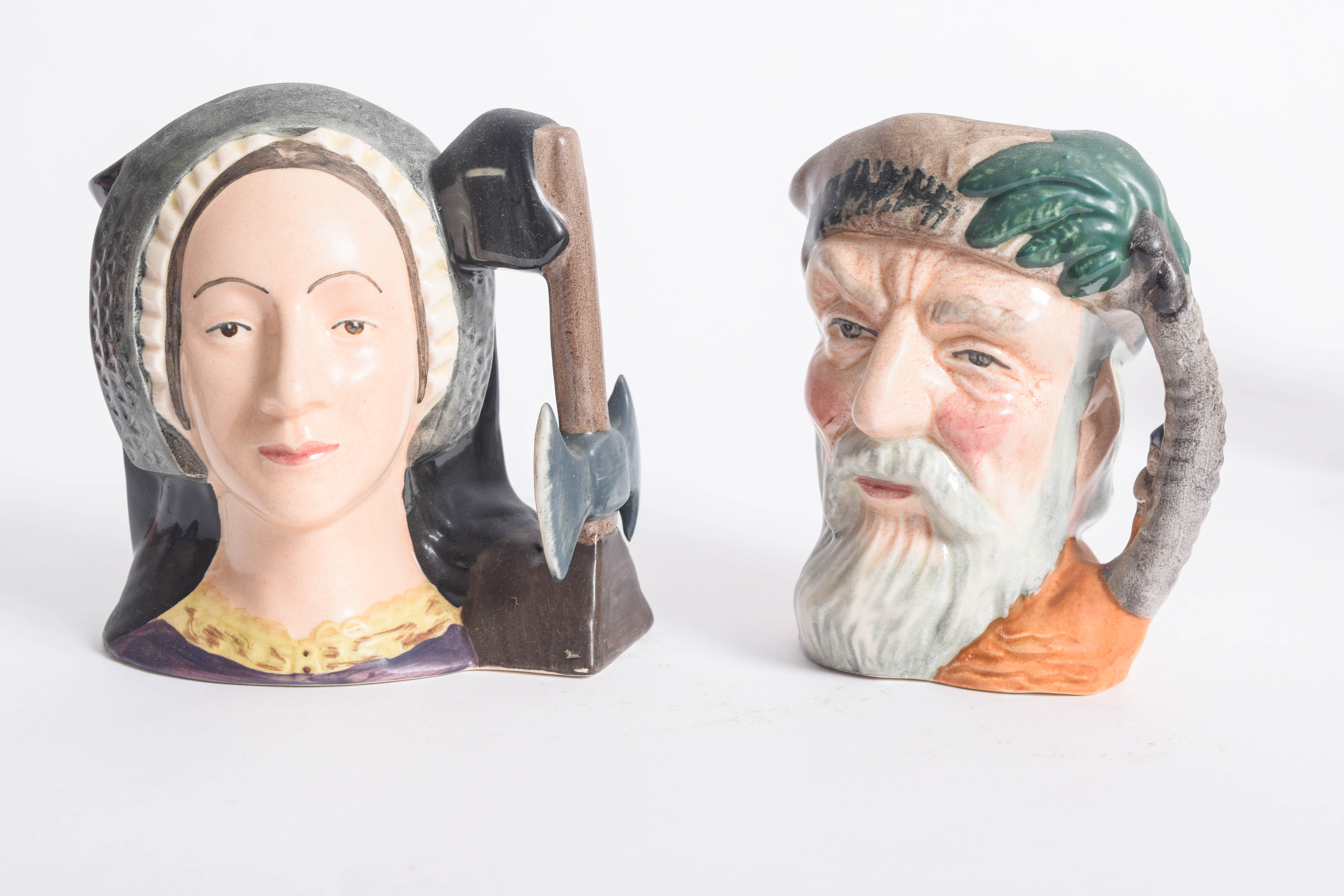 Generous Assortment of  of Royal Doulton Toby Jugs and Character Mugs