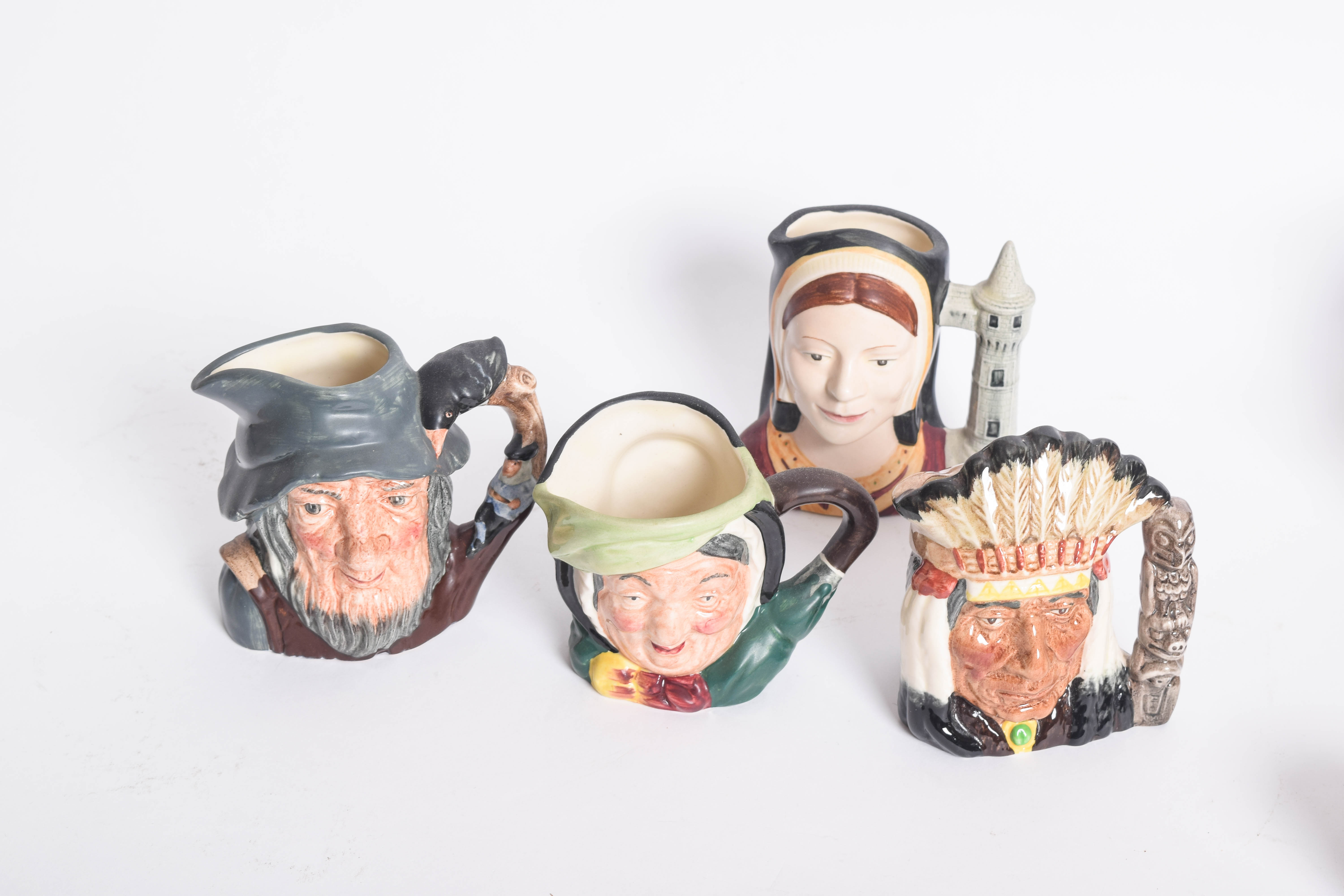 Generous Assortment of  of Royal Doulton Toby Jugs and Character Mugs